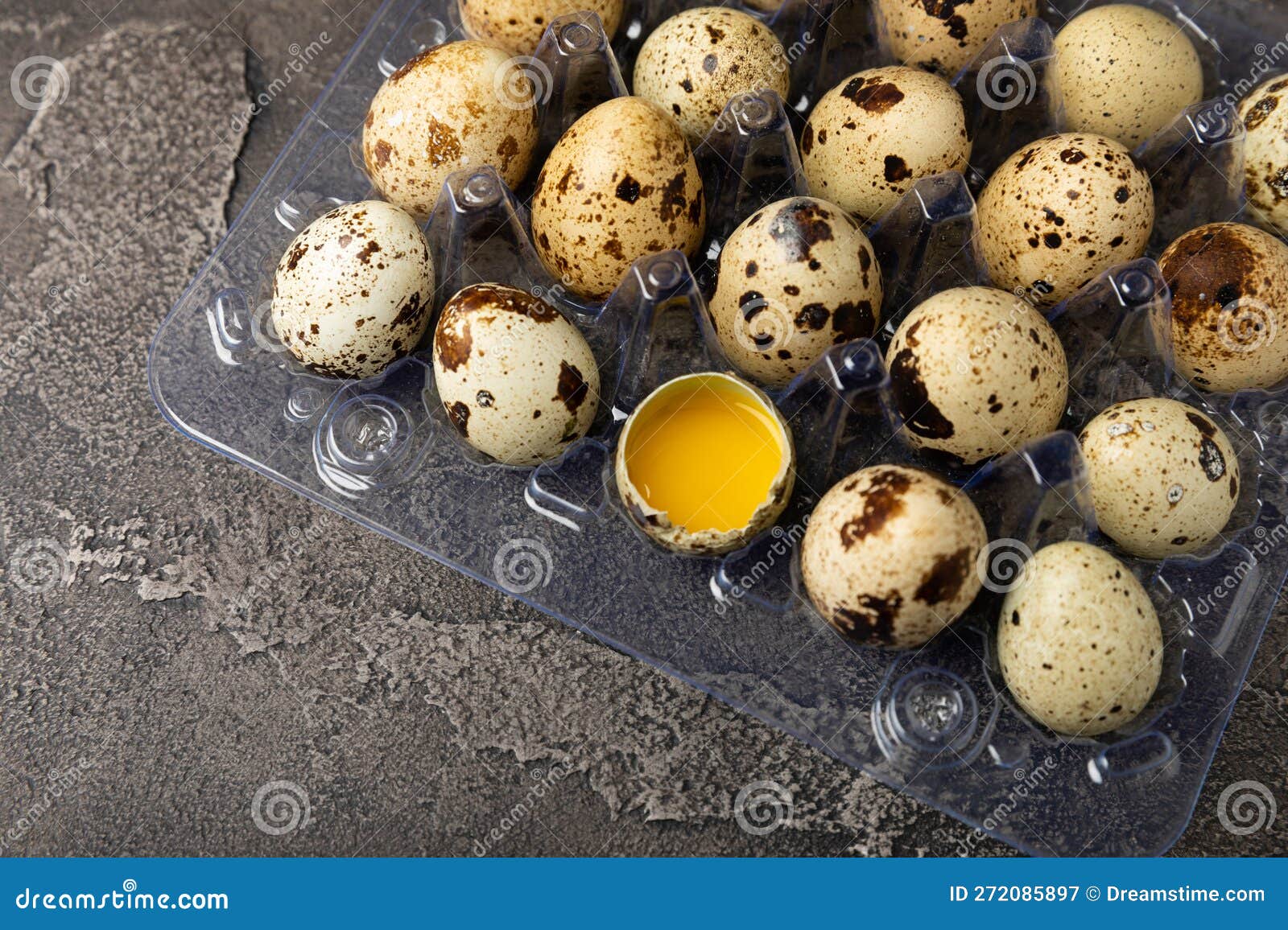 quail eggs on black texture background.
