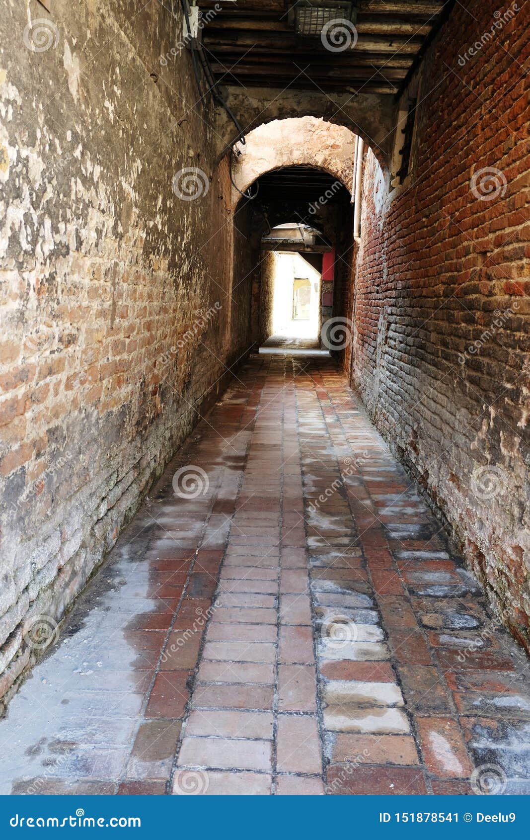 empty narrow italian alleywayin venice, italy