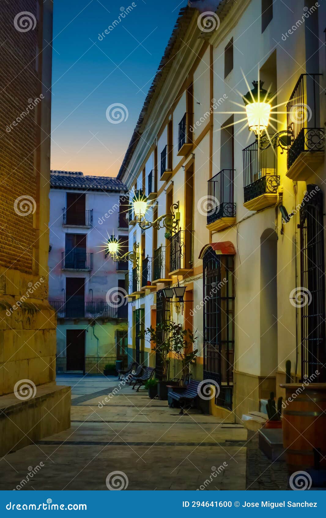 quaint narrow alley at dusk in the andalusian village of velez rubio, almeria, spain.