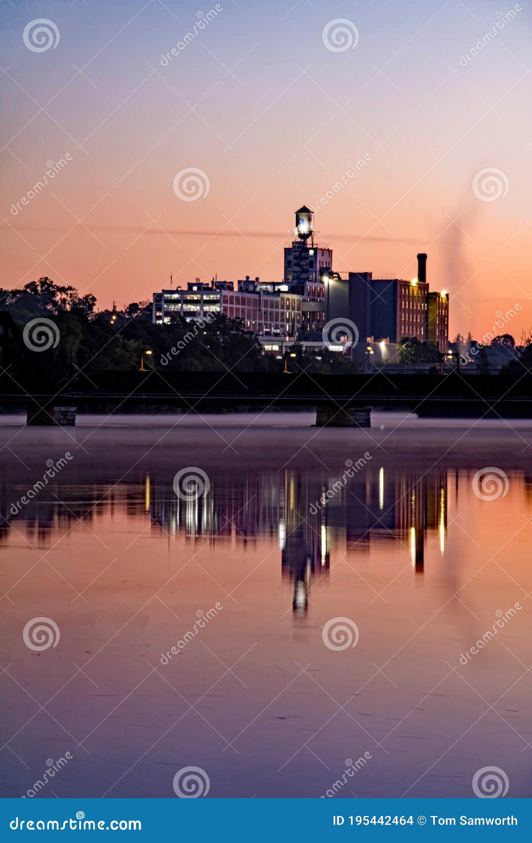 quaker oats building at sunrise on the otonabee river in peterborough, ontario