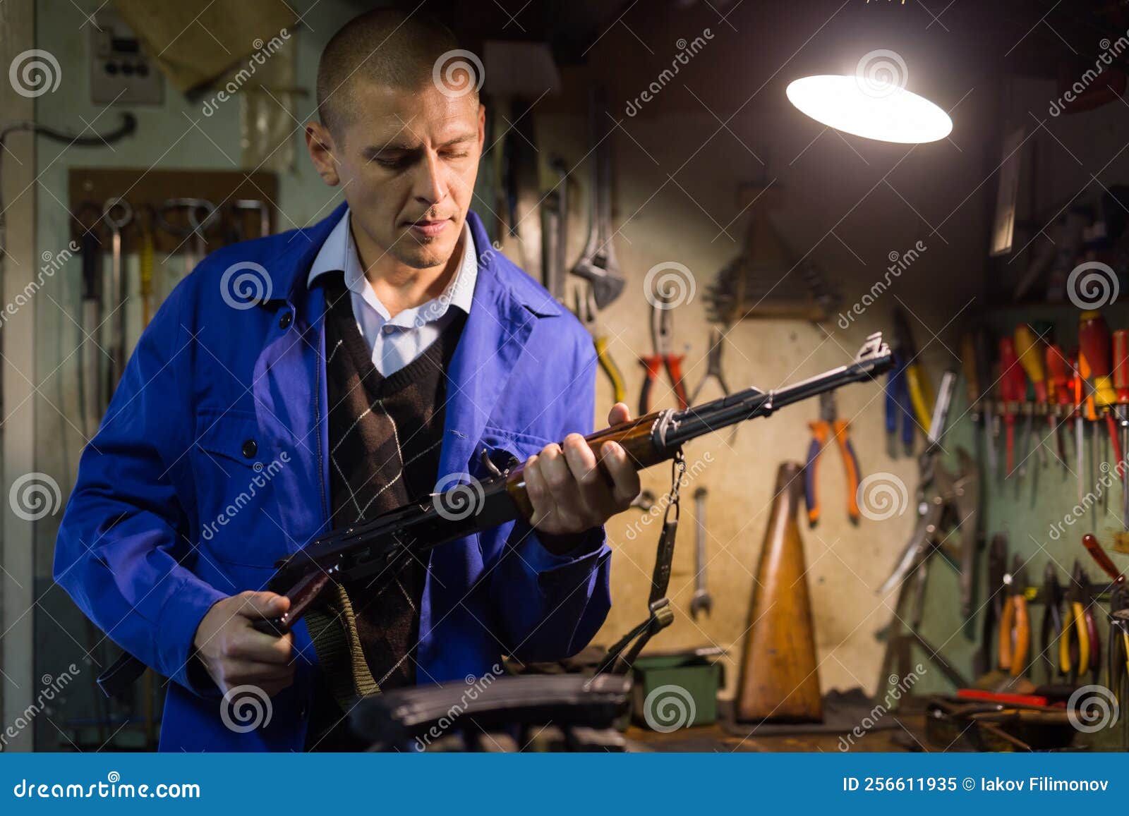 Gunsmith Performing Maintenance of Kalashnikov Assault Rifle in