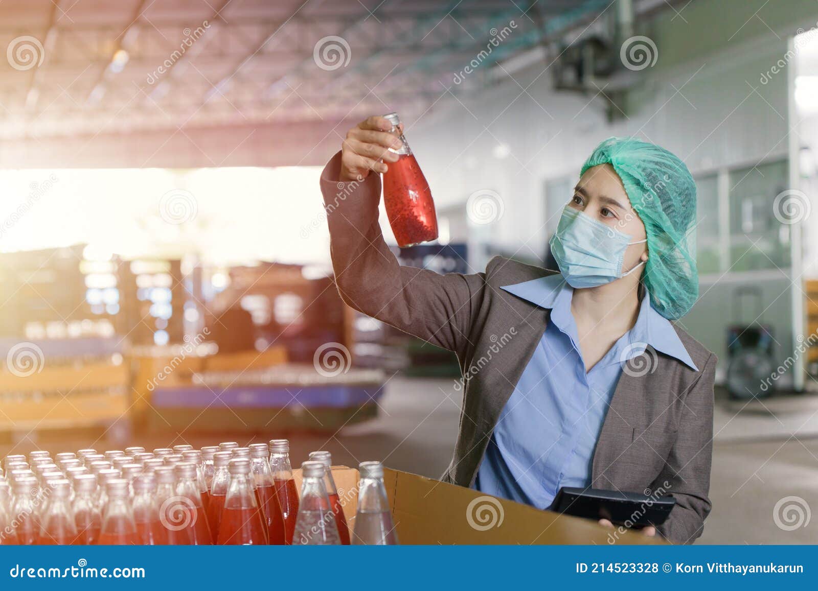 quality control inspector person working in drink factory to random check contaminate the final products
