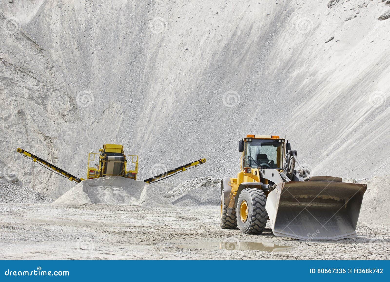 Quarry Aggregate with Heavy Duty Machinery. Construction Industry Stock