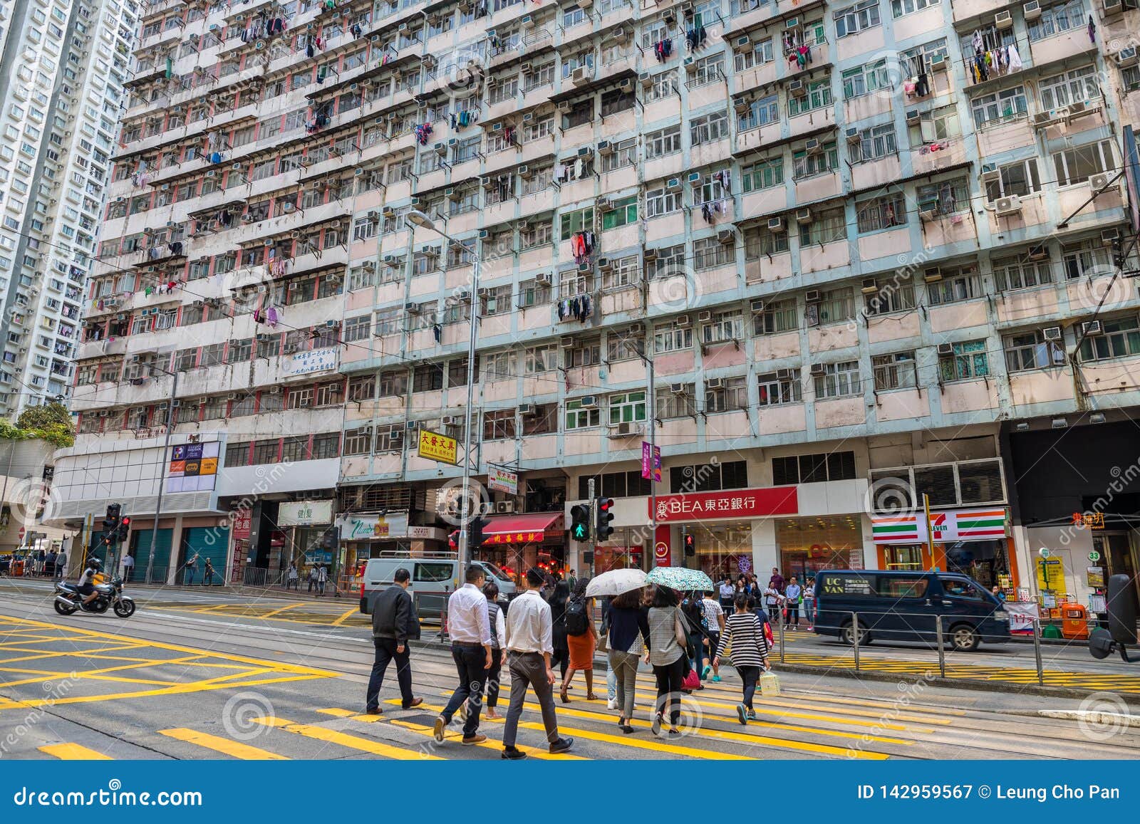 Quarry Bay, Hong Kong Old Town with People Walk in the Street Editorial