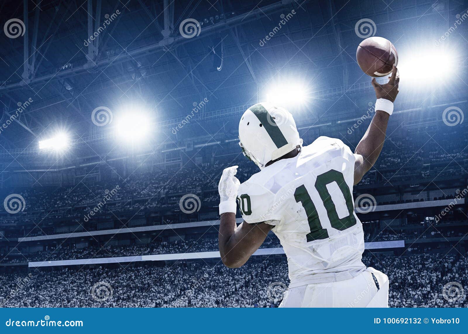 quarterback throwing a football in a professional football game