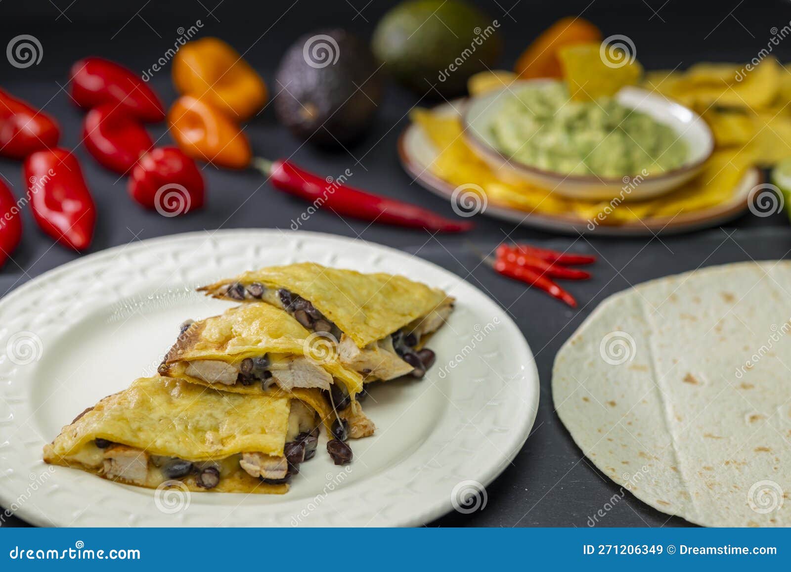 Quesadilla with Chicken Meat and Beans and Guacamole with Nachos Stock