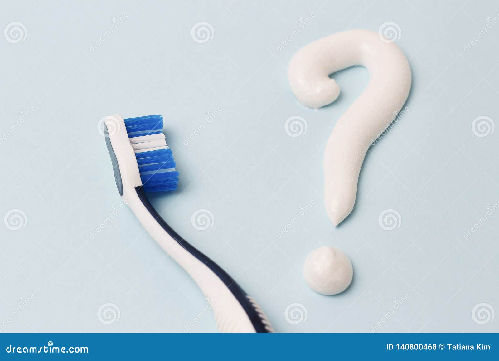 Question Mark from Toothpaste and Toothbrush on Blue Background, Choice Concept Stock Photo
