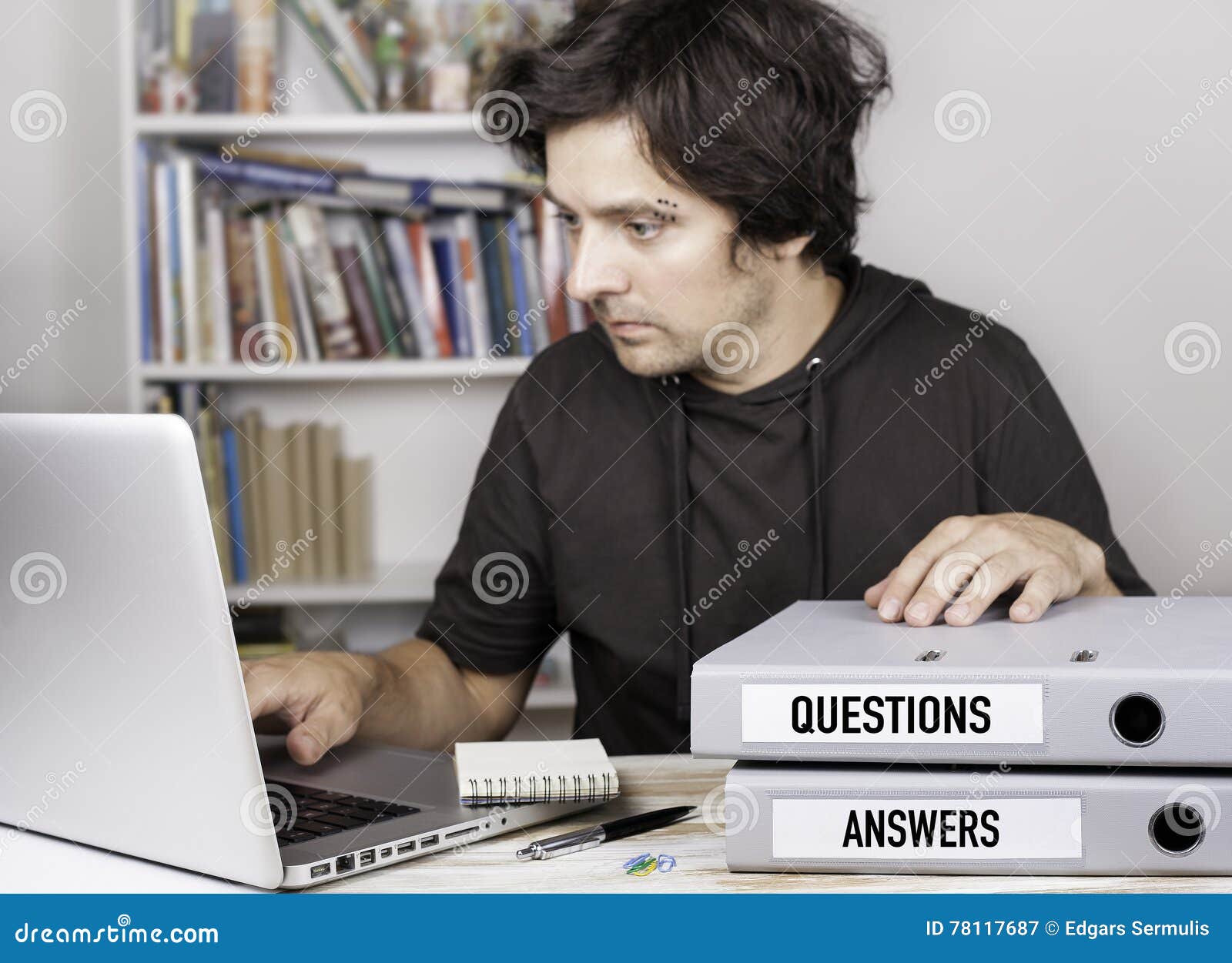 Questions and Answers Two Folders on Office Desk. Man Working Stock