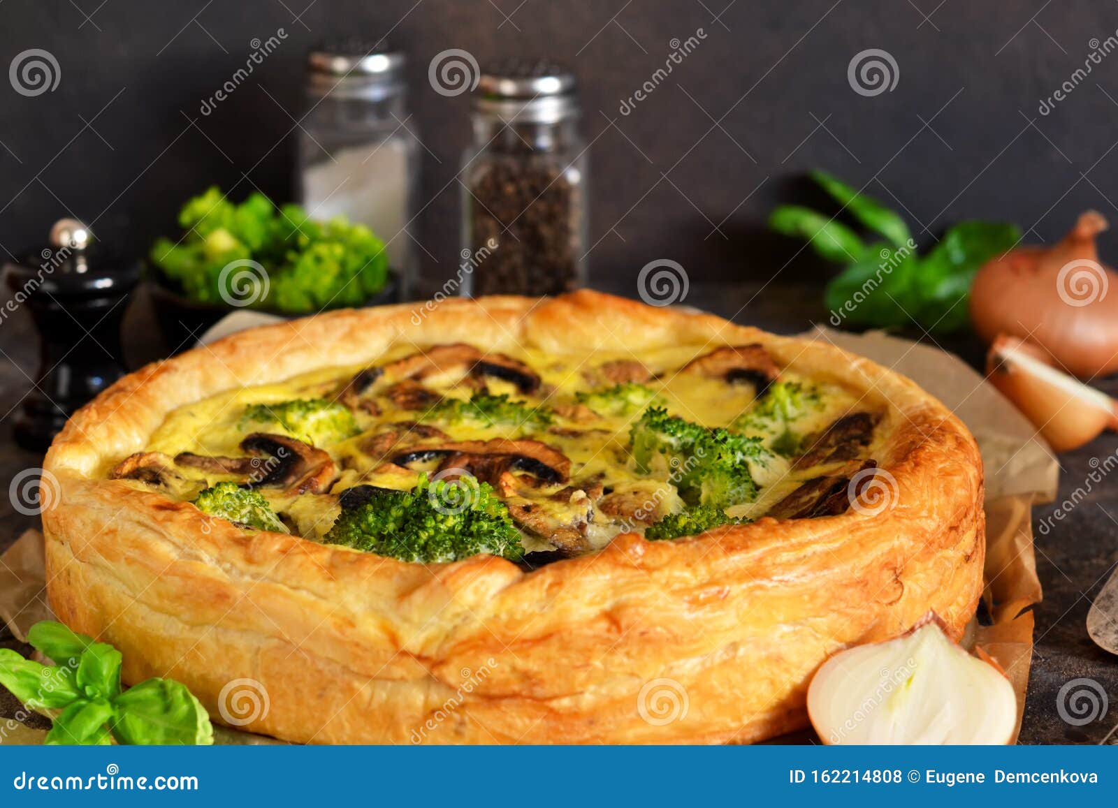 Quiche with Mushrooms, Onions and Broccoli on a Concrete Background ...