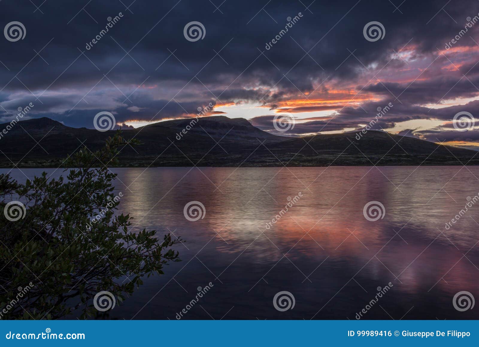 A Quiet Norwegian Lake at Sunset in the Rondane National Park in Stock ...