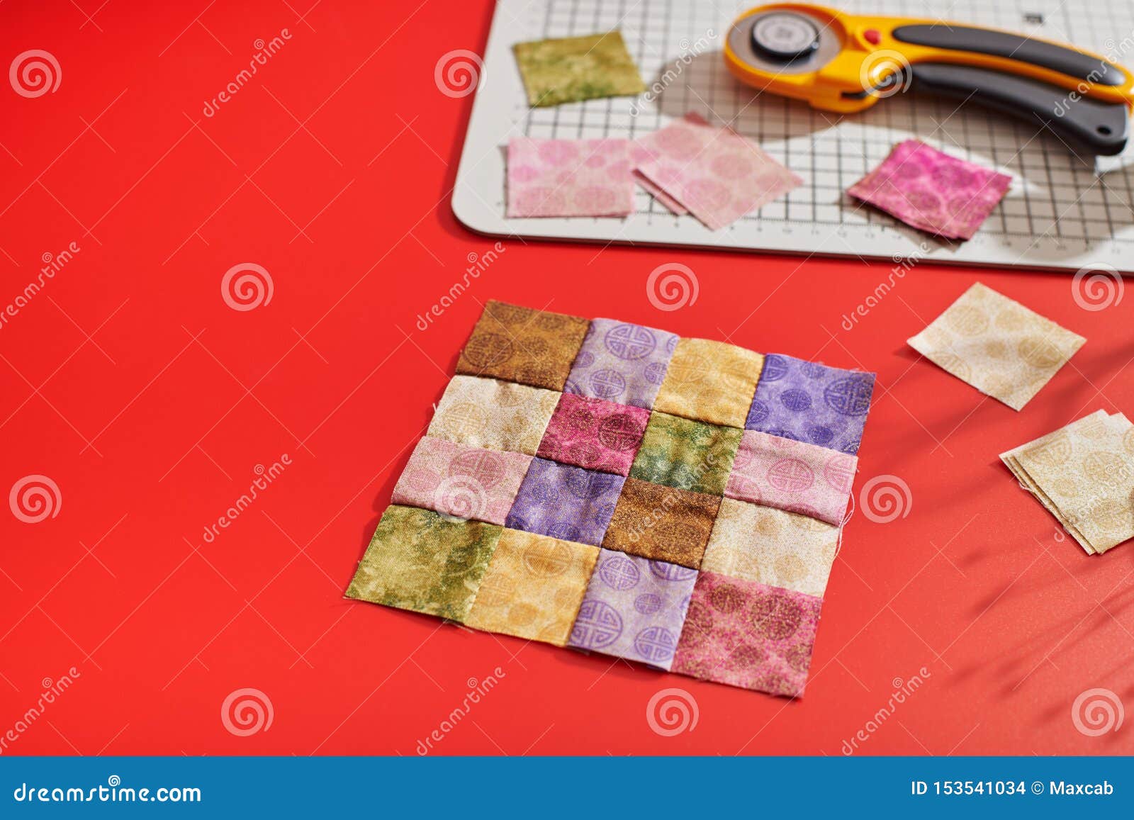 Quilting Block From Bright Square Pieces Of Fabrics Rotary Cutter