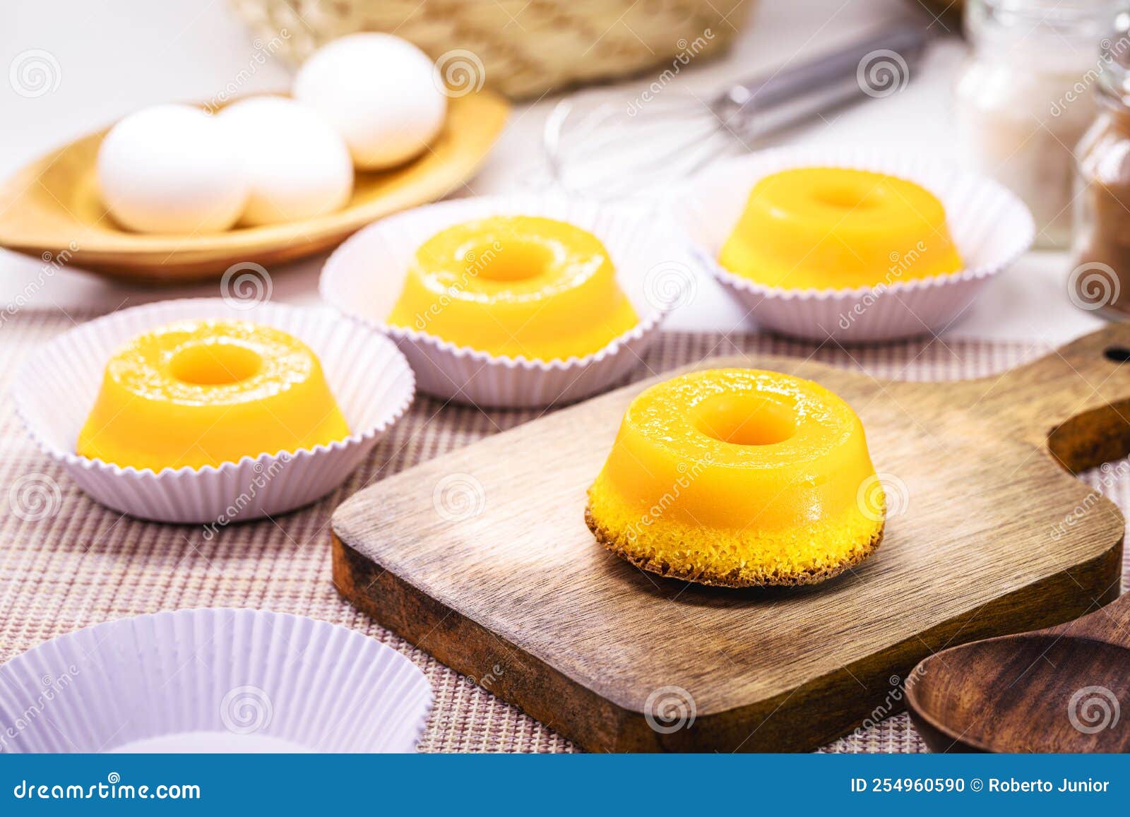 quindim or brisa do lis, tasty dessert made with eggs in the background, typical recipe from brazil and portugal