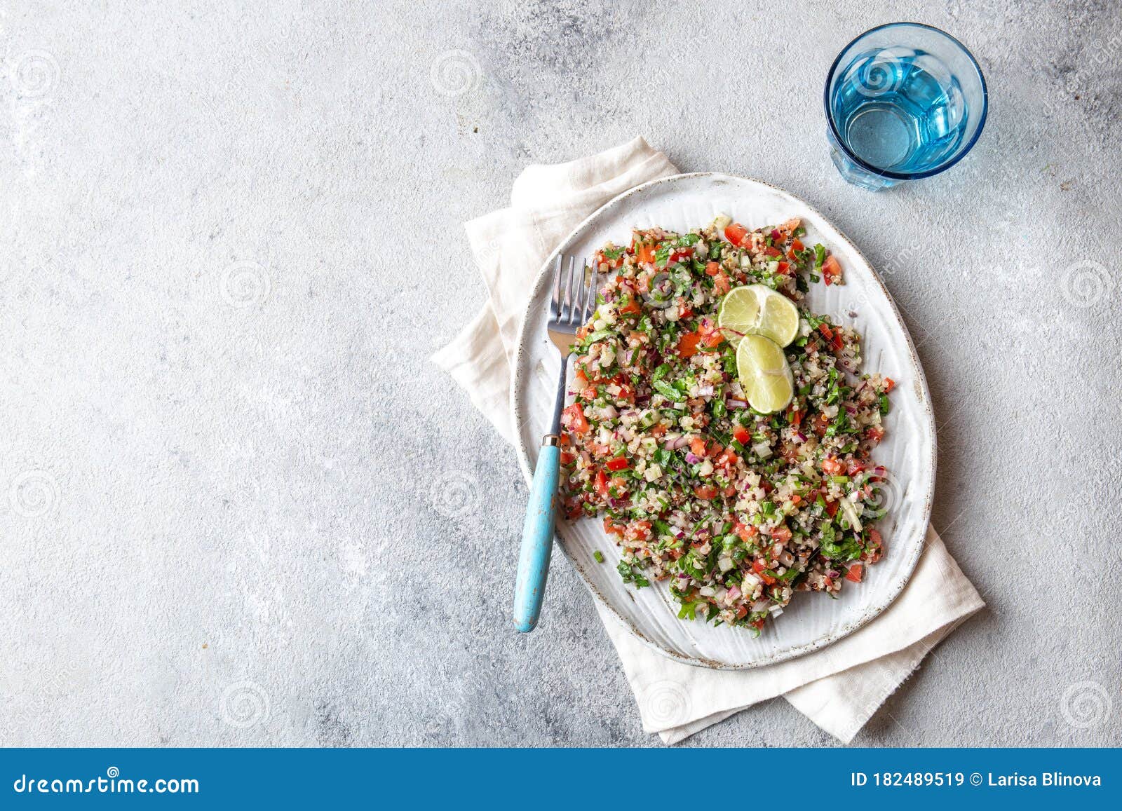 quinoa quinua salad with tomatoes and herbs in white bowl