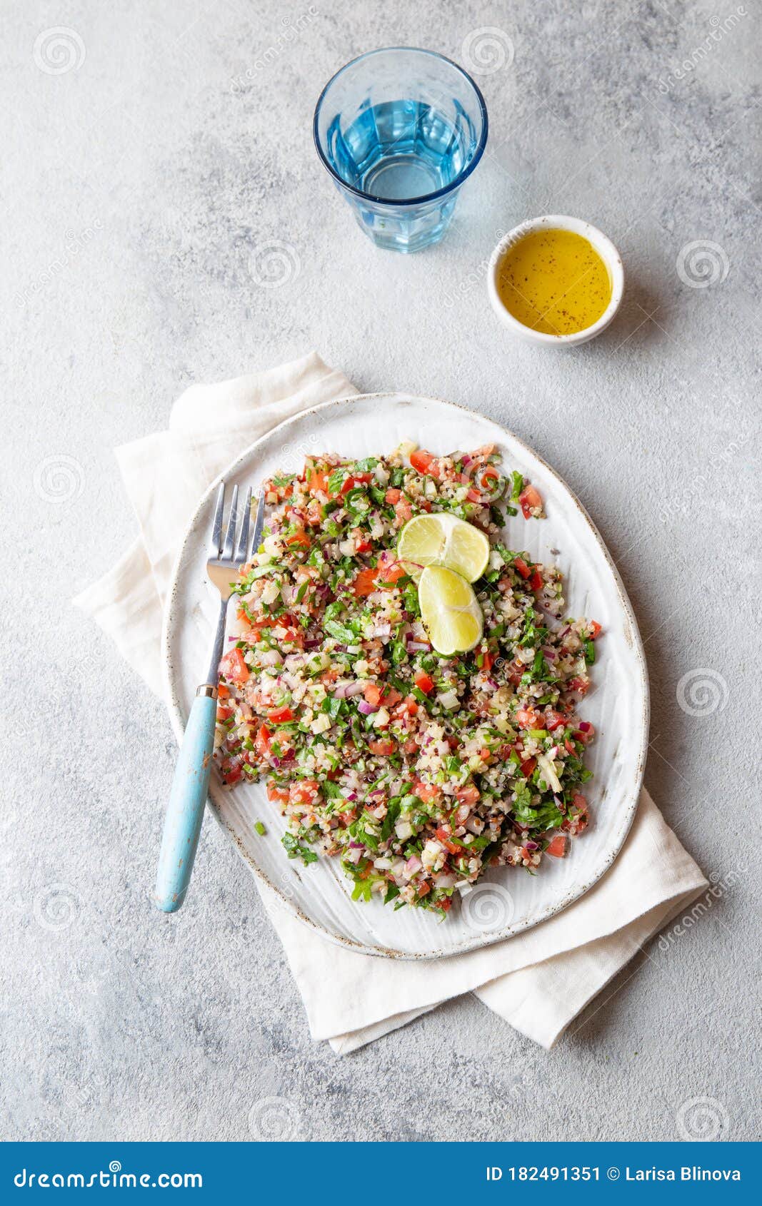 quinoa quinua salad with tomatoes and herbs in white bowl