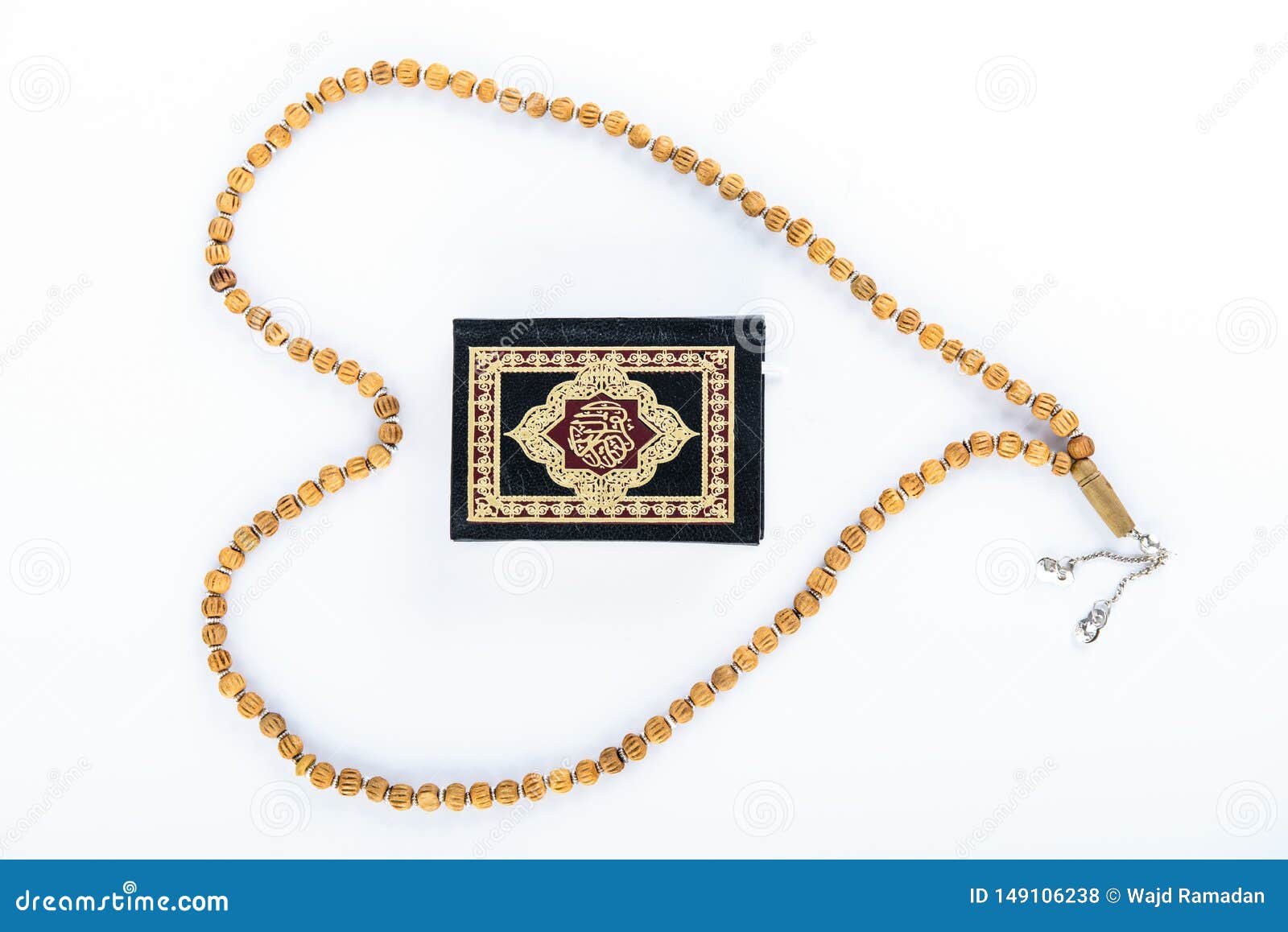 quran with rosary - holy book of muslims - koran - quran white background