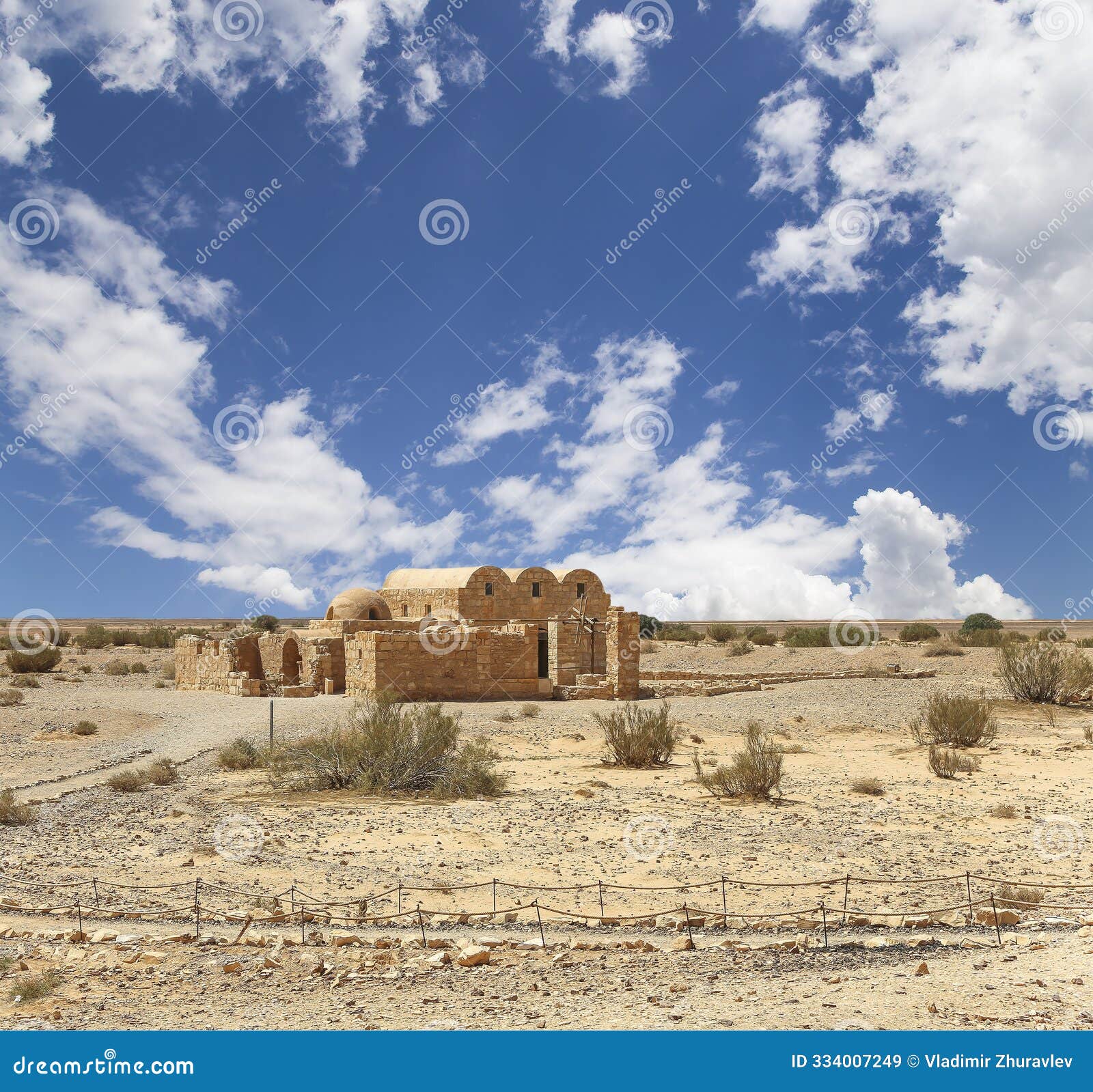 quseir (qasr) amra desert castle (against the sky with clouds) near amman, jordan.