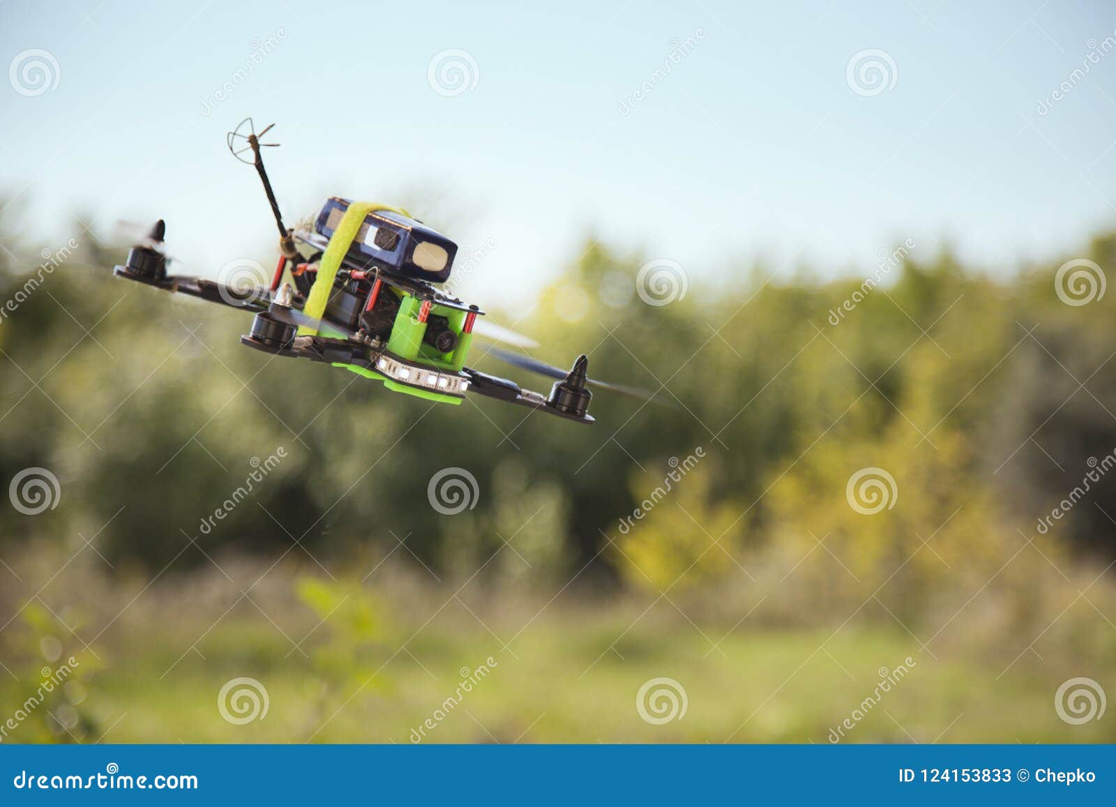 A Dog Chasing A Remote Controlled Toy Car. Former Shooting Range