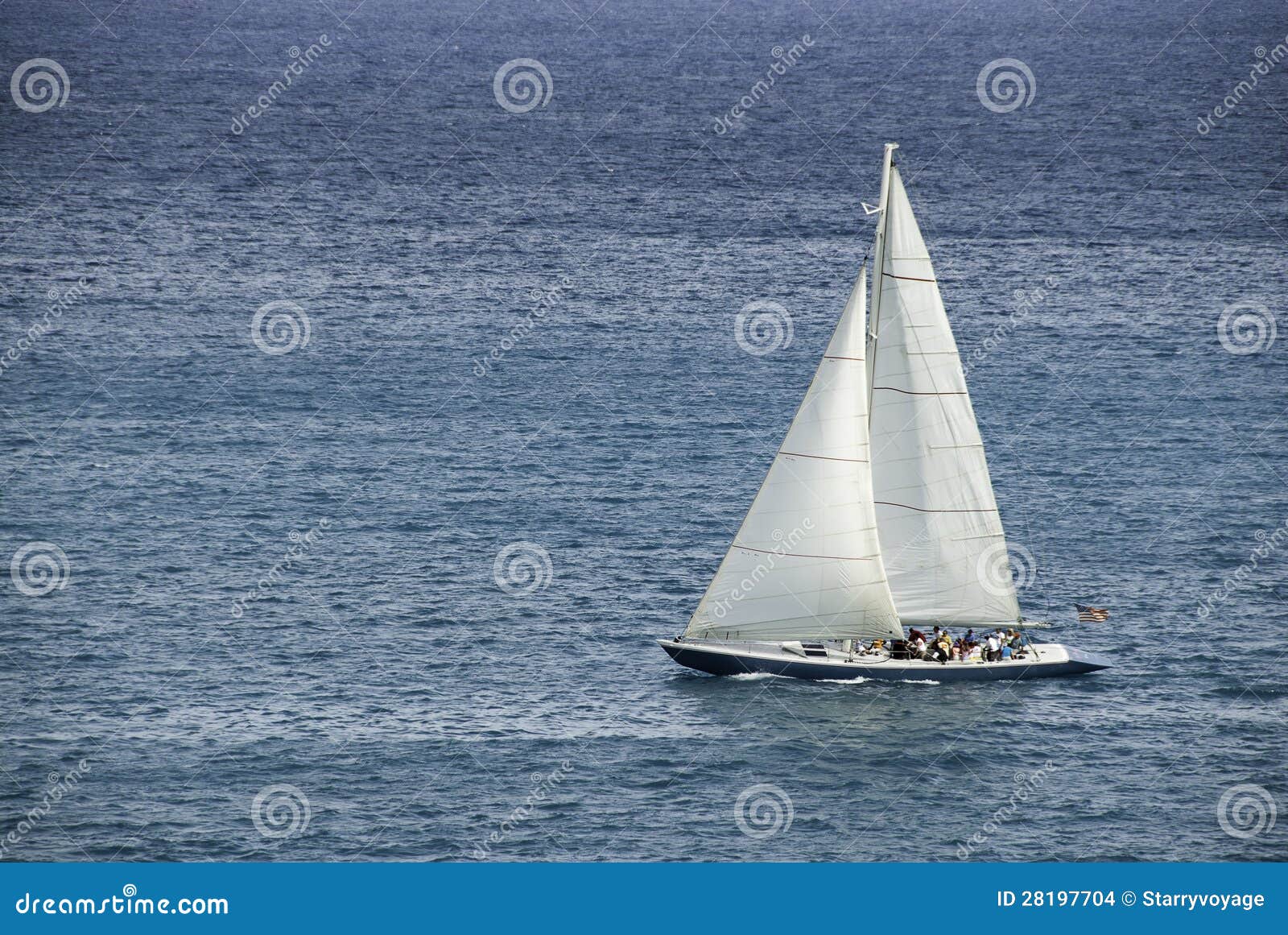 racing sloop in the caribbean