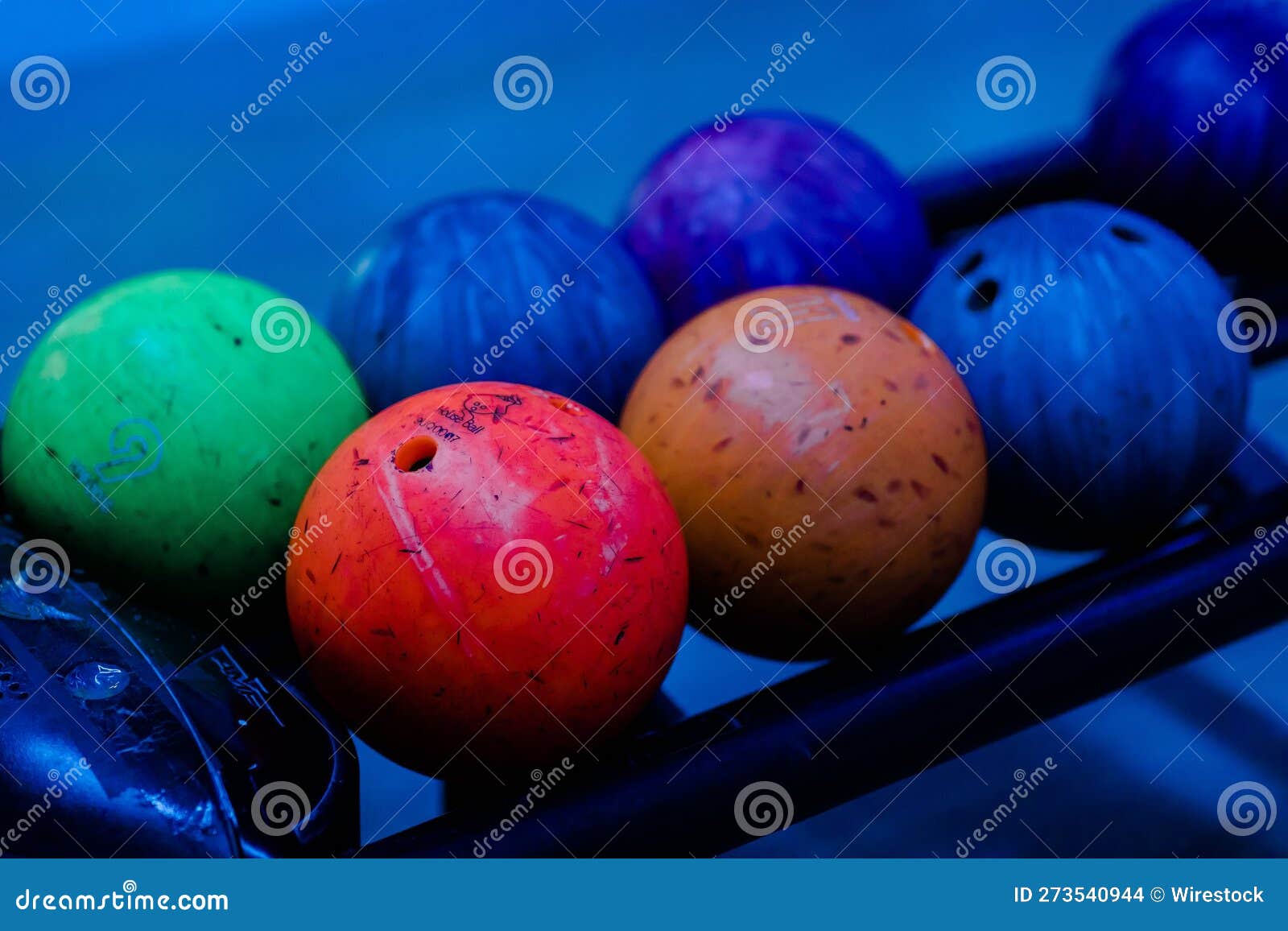 Rack Filled with a Colorful Assortment of Rainbow-hued Bowling Balls ...