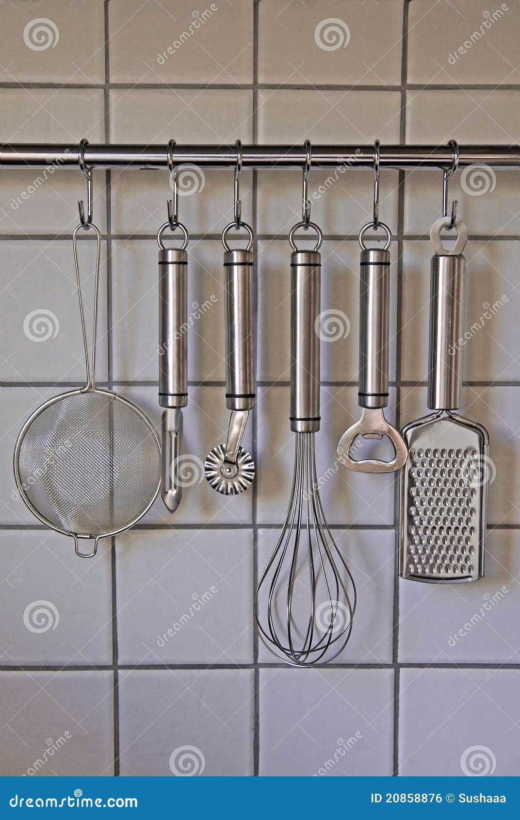 Rack of kitchen utensils stock photo. Image of kitchenware 20858876