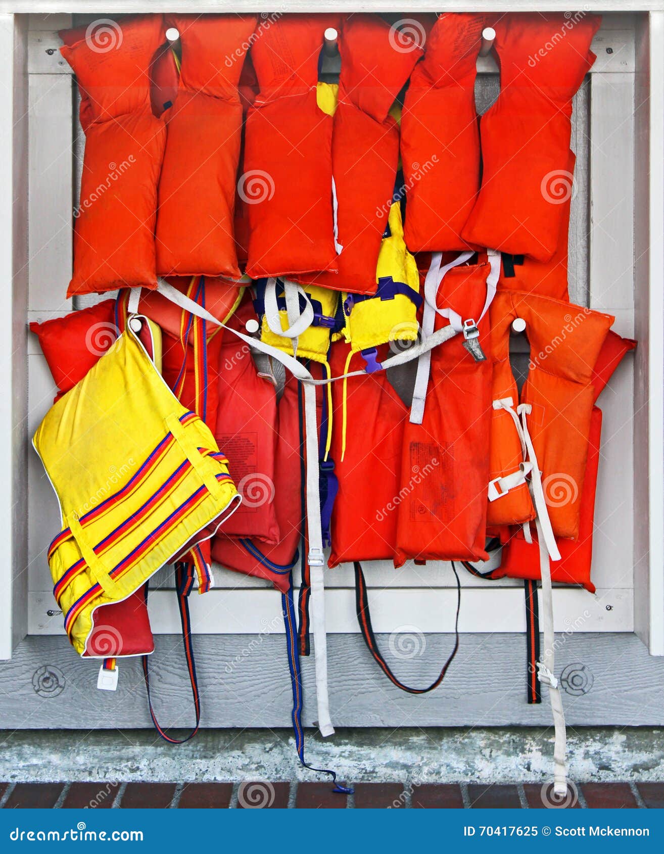 Rack of Life Vests stock image. Image of hanging, life 70417625