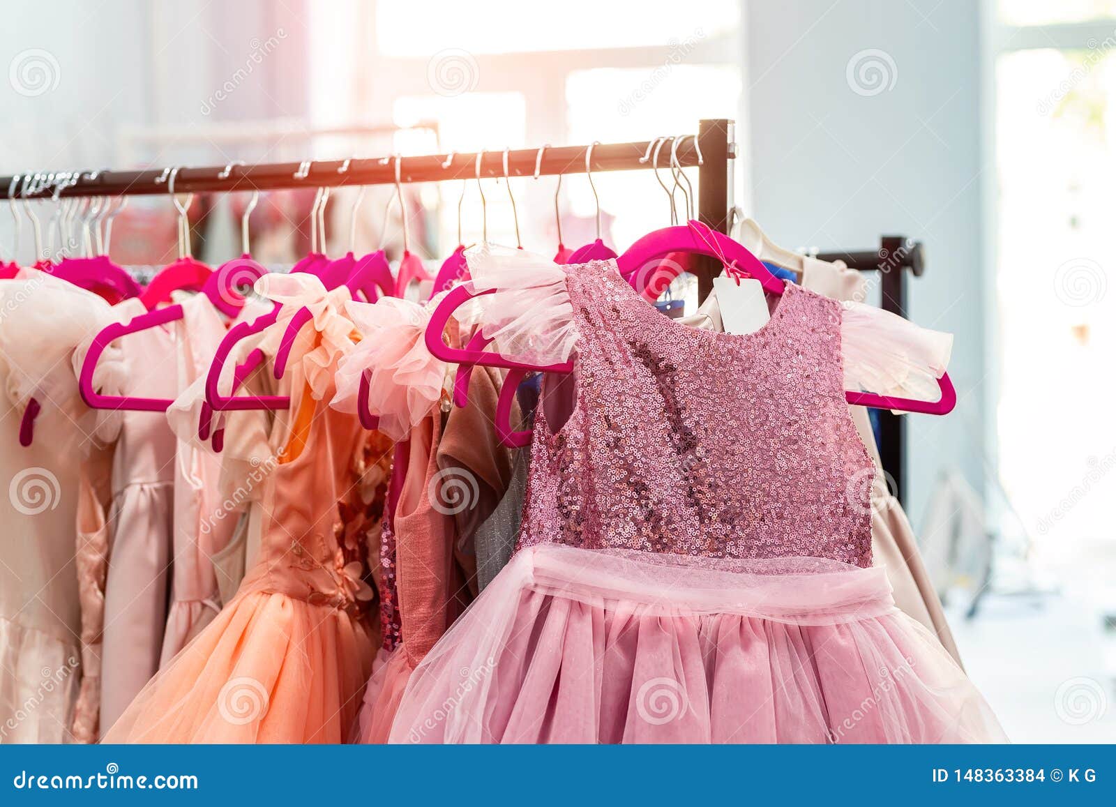 Rack with Many Beautiful Holiday Dresses for Girls on Hangers at ...