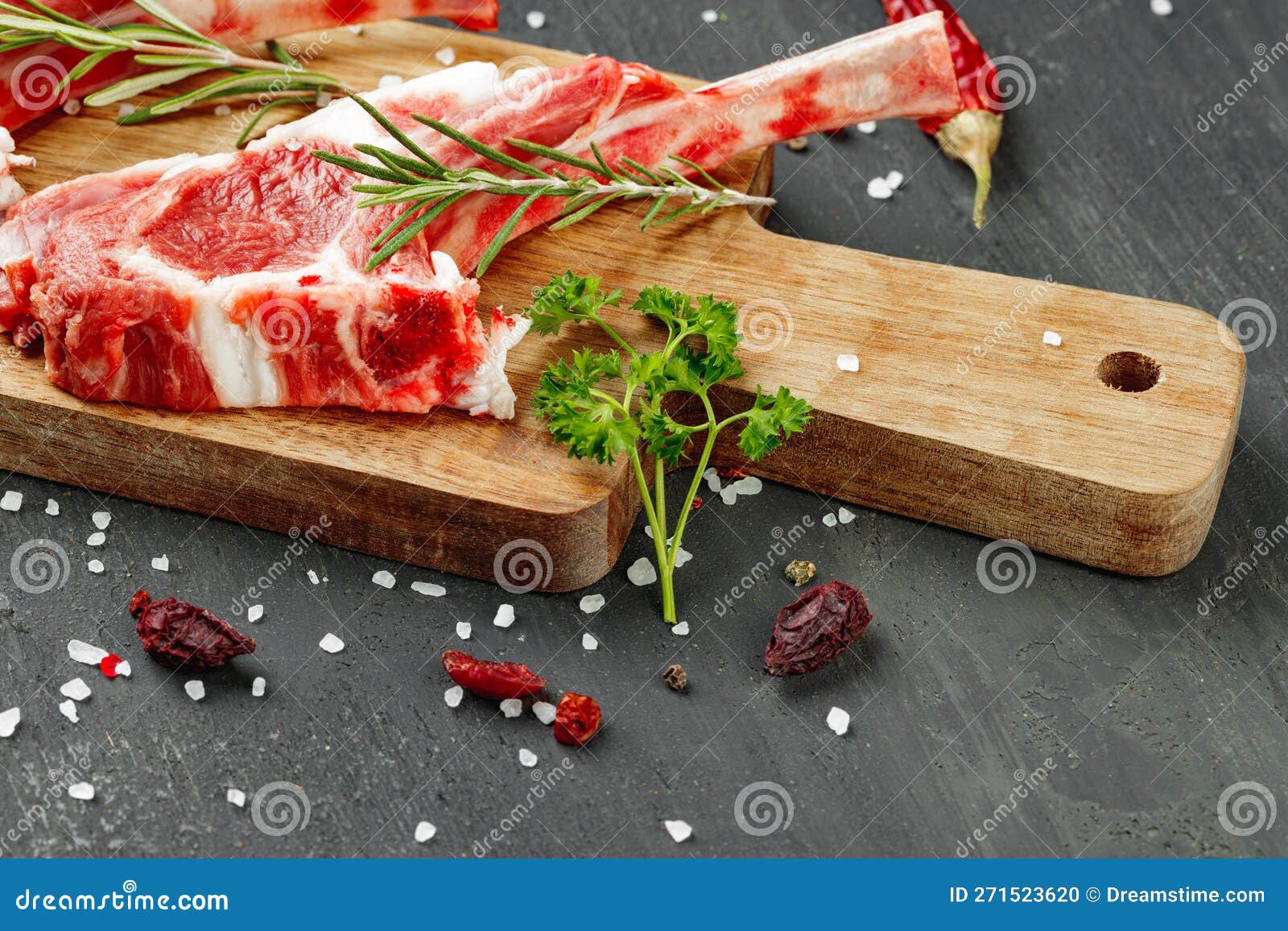 Racks of Lamb Ready for Cooking on Dark Background, Close Up Stock