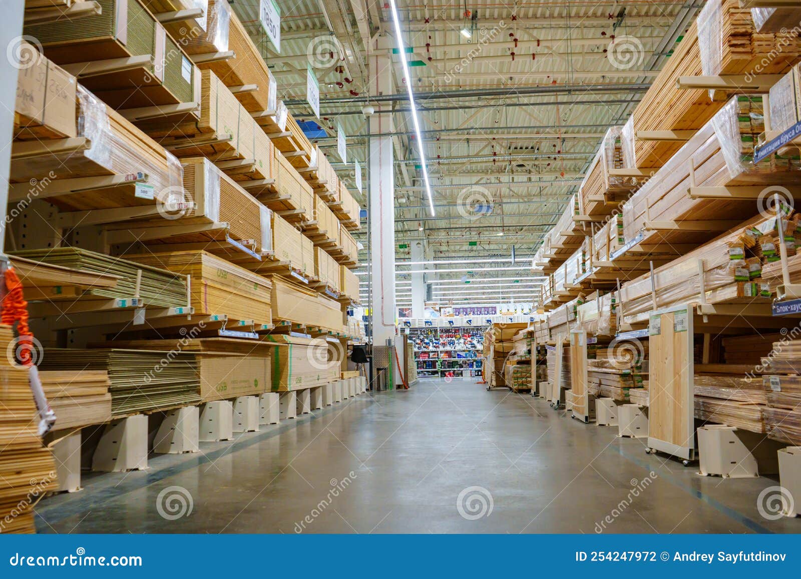 Racks With Wooden Boards And Slabs In The Warehouse Of The Hardware racks-with-wooden-boards-and-slabs-in-the-warehouse-of-the-hardware