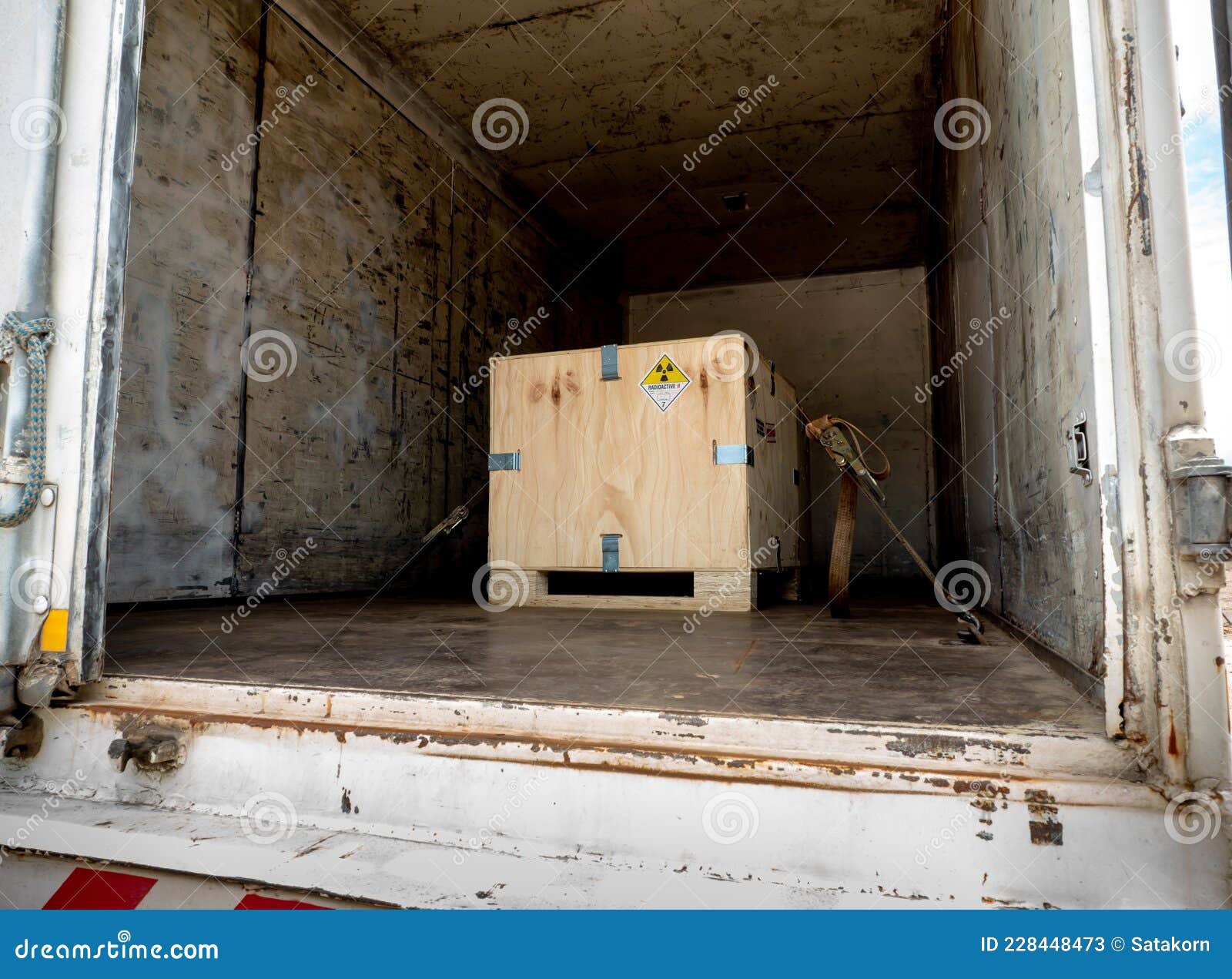 radiation label beside the transport wooden box type a package in the truck