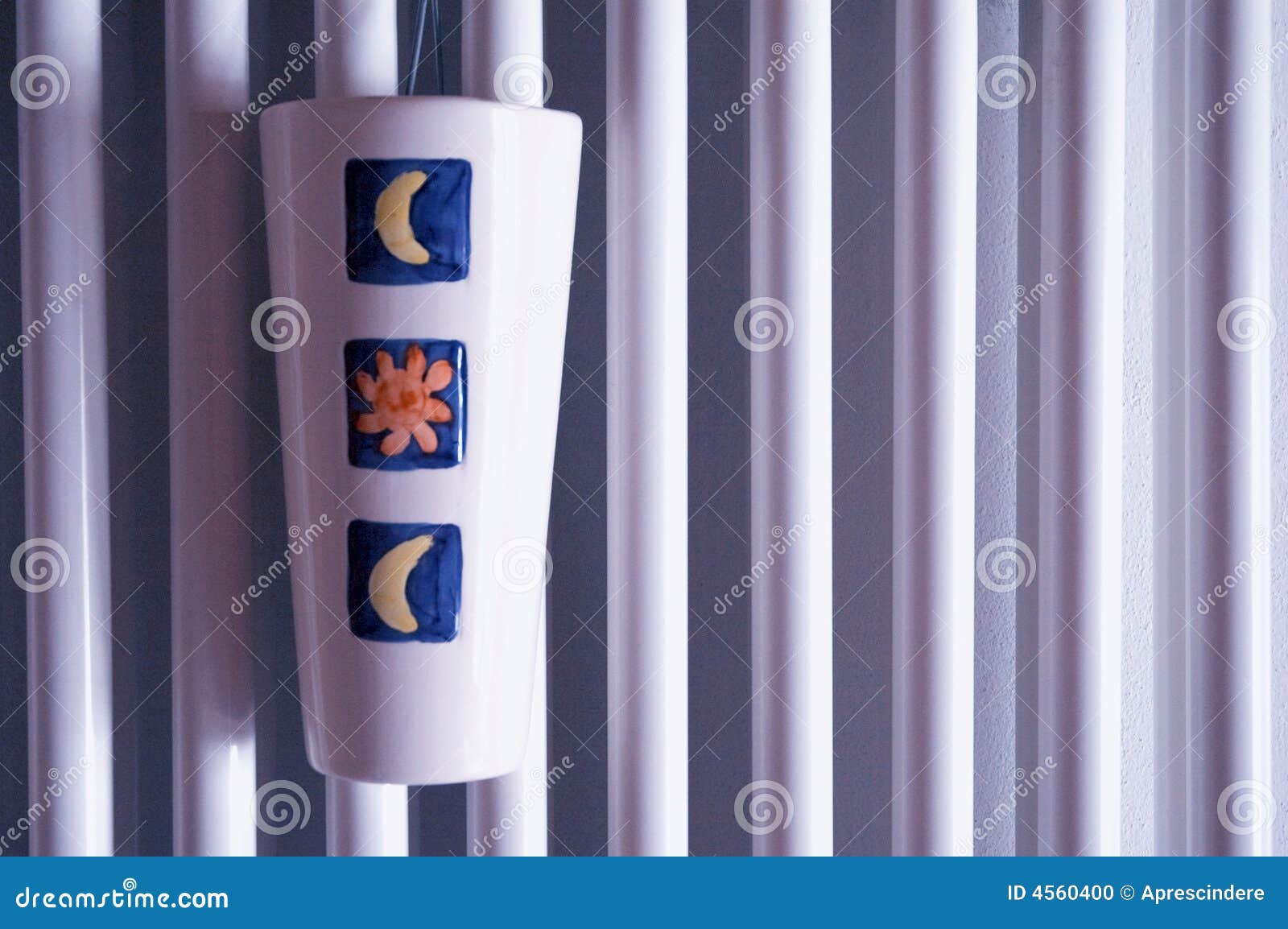 Closeup view of radiator surface with humidifier in violet light