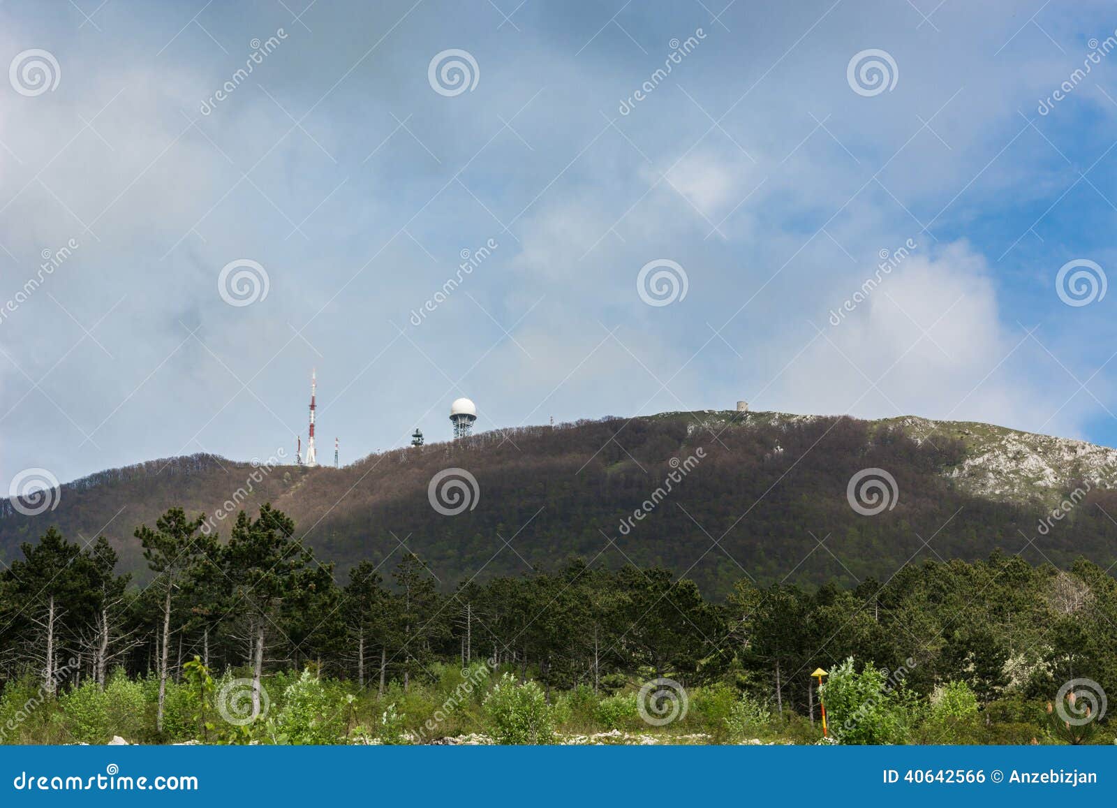 radio antenna and radar on top of a mountain