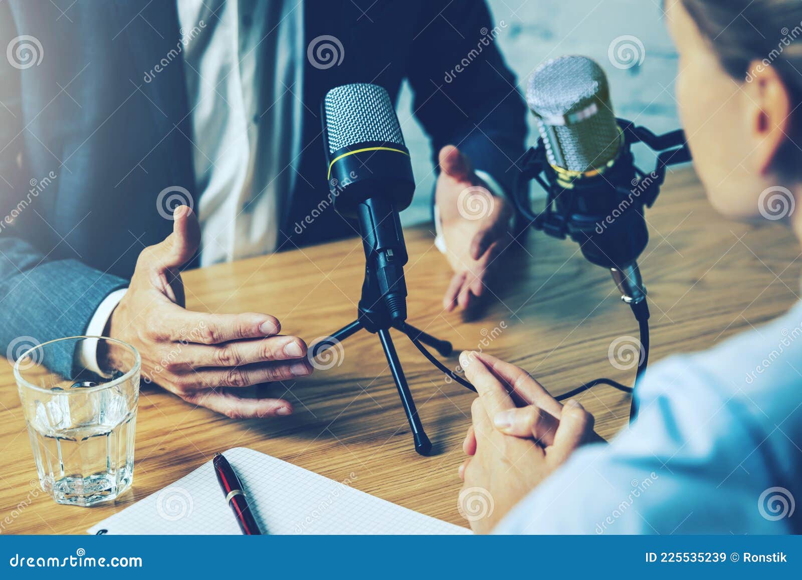 radio interview, podcast recording - business people talking in broadcasting studio