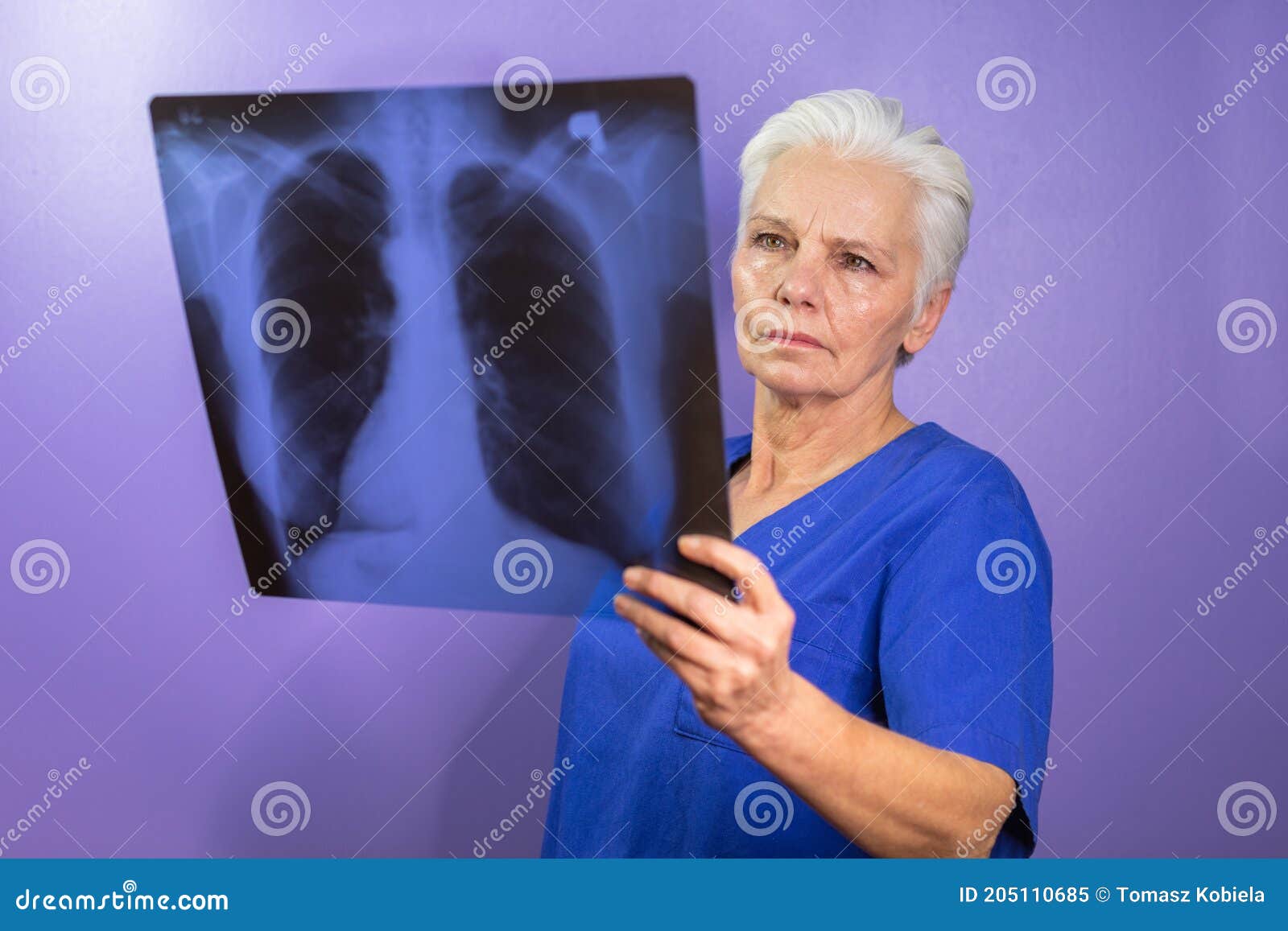 Radiologist in a Blue Uniform Studying an Xray Stock Image Image of
