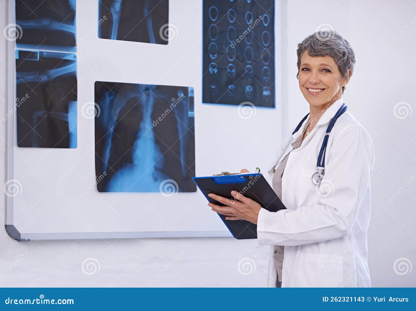 Radiology is Her Specialty. a Female Doctor Studying Xrays. Stock Image Image of care