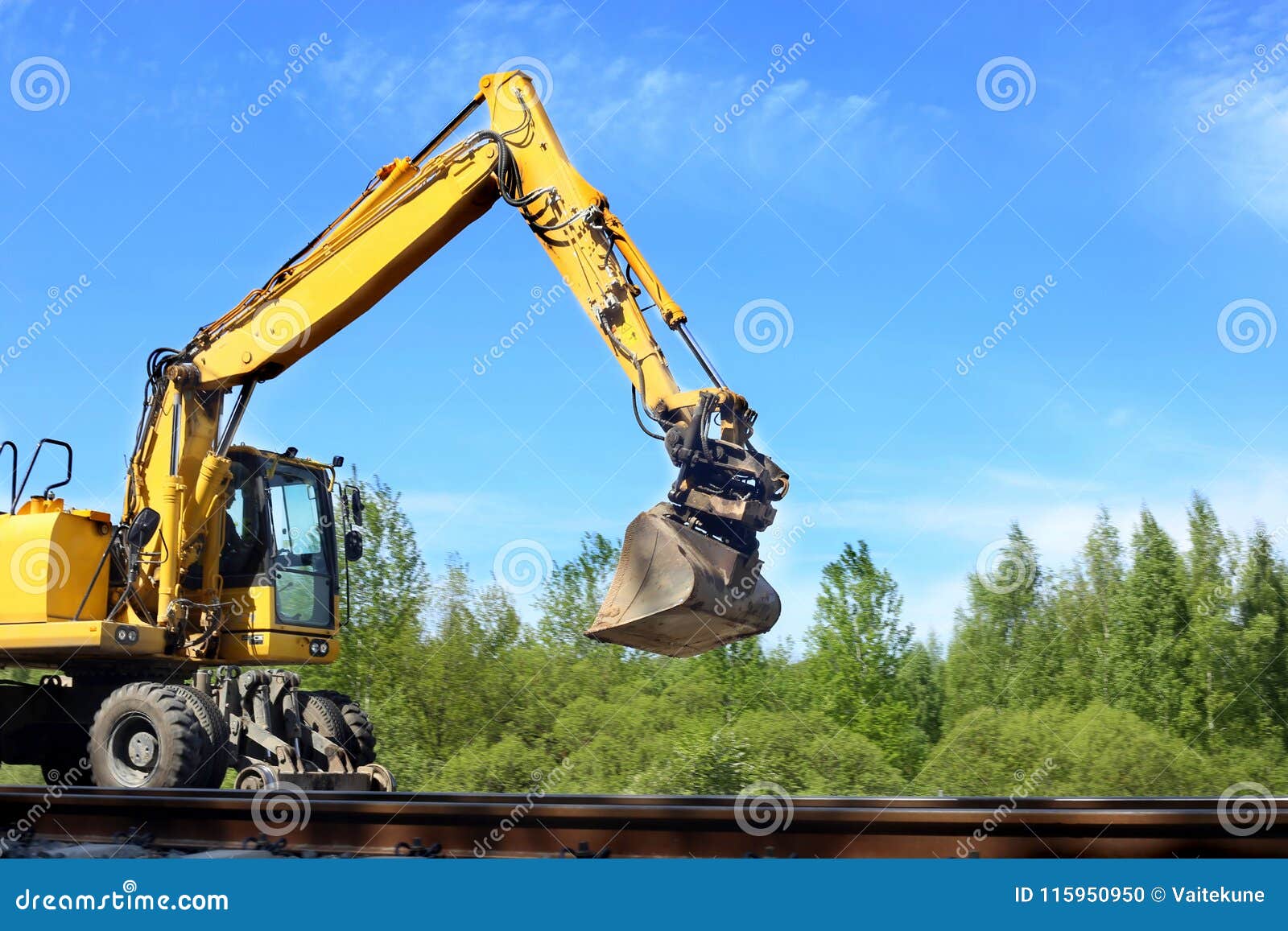 Rail Excavator Working with Rubble. Stock Photo Image of excavation