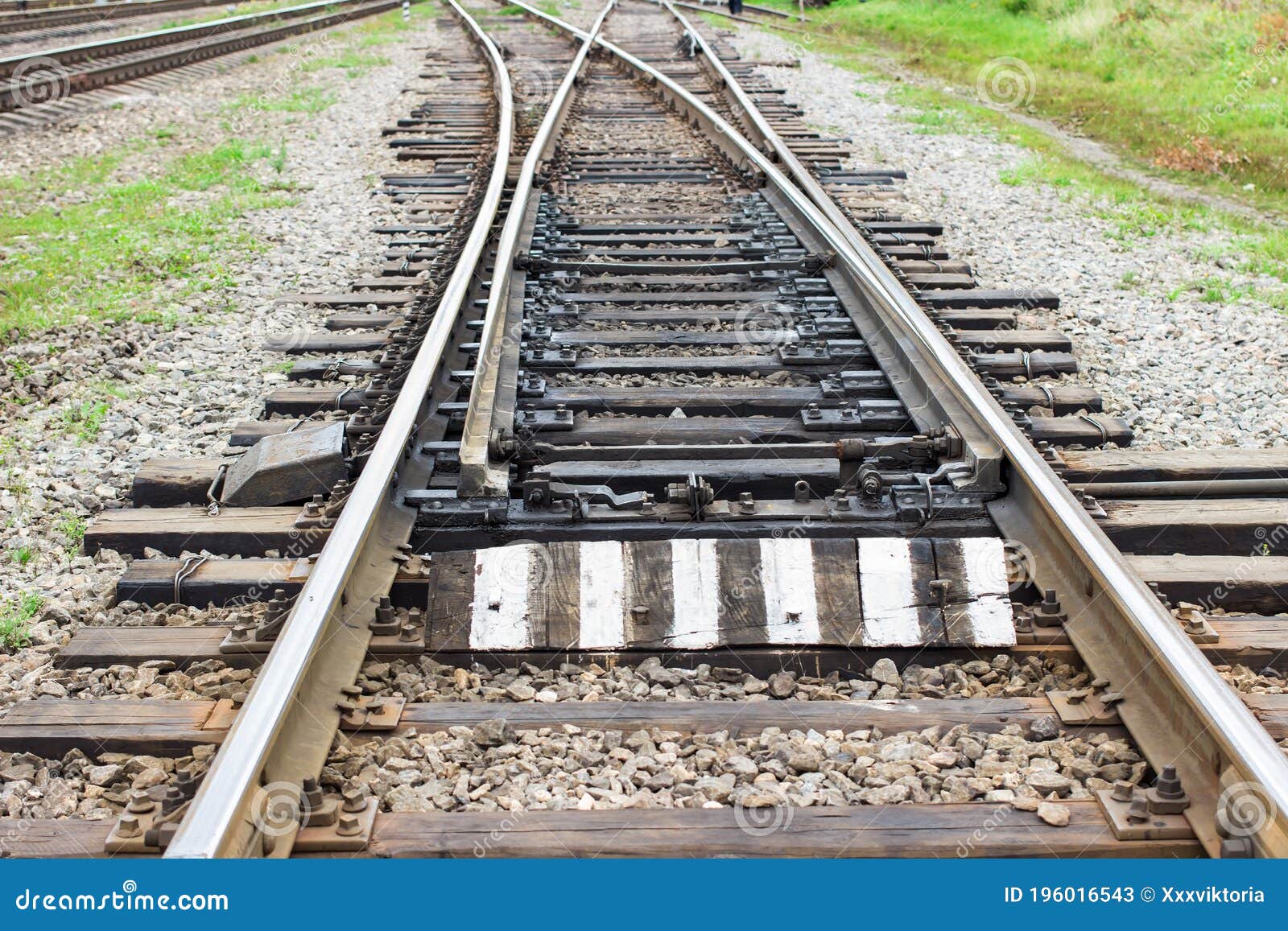 rail tracks with rail sleepers at the railway pointwork. change of direction. railway arrows with rail track s