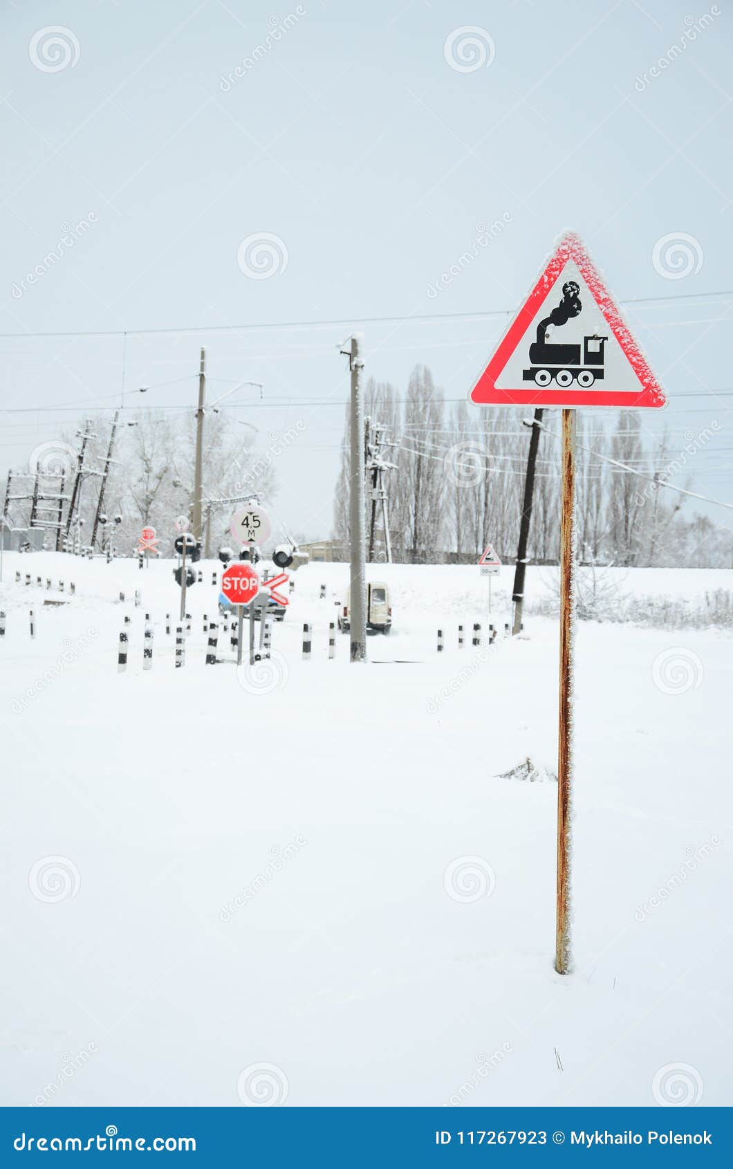 Railway Crossing Without A Barrier With A Lot Of Warning Signs In The Snowy Winter Season Stock Image Image Of Railroad Equipment