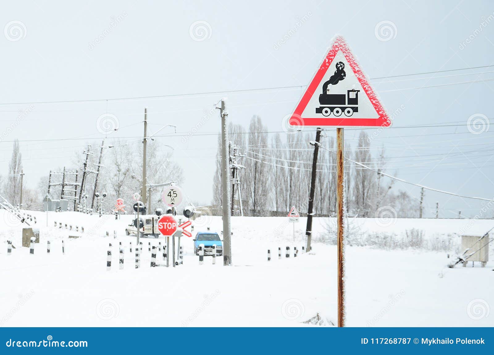 Railway Crossing Without A Barrier With A Lot Of Warning Signs In The Snowy Winter Season Stock Image Image Of Sign Travel