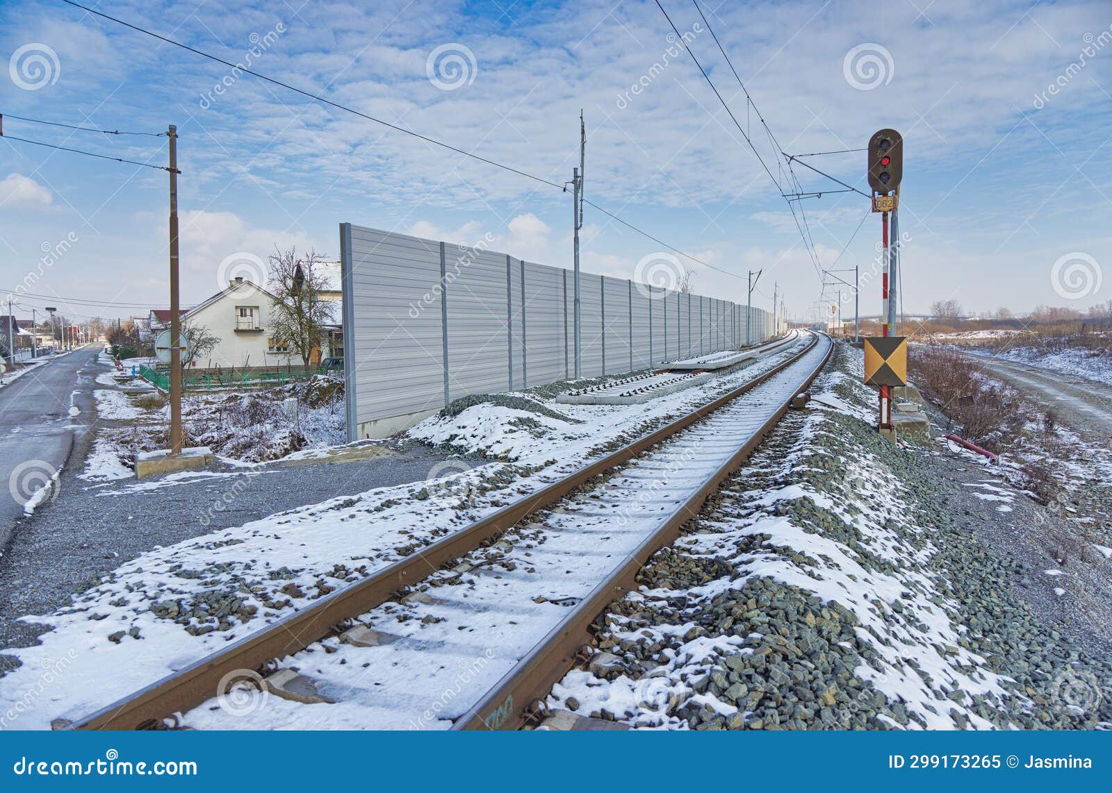 snowy tracks beside sound barrier in dugo selo, croatia