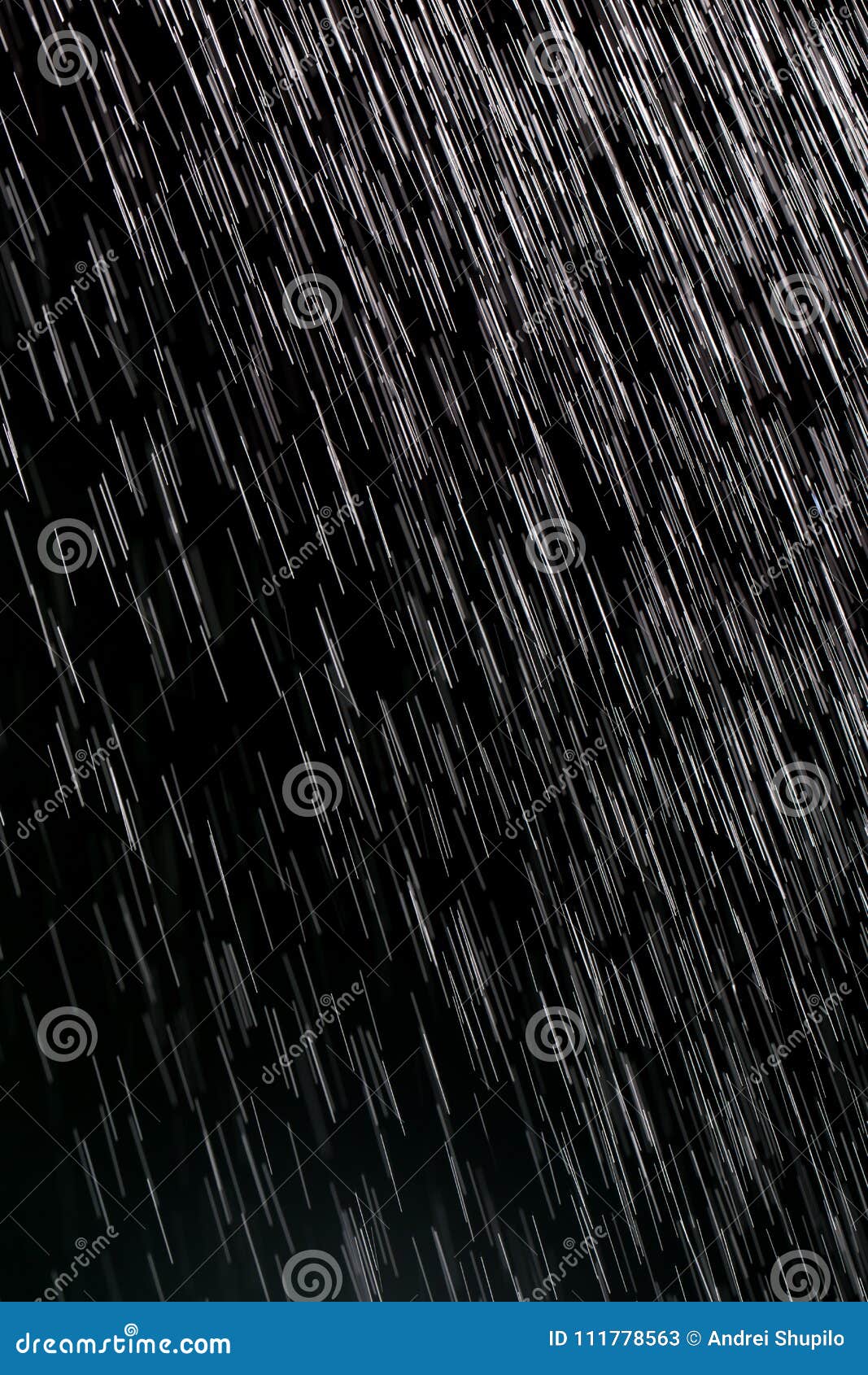 Rain on a black background stock image. Image of water 111778563