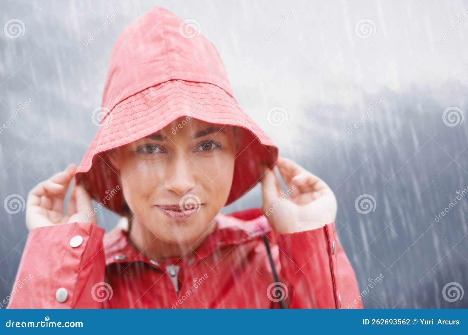 Rain...but Im Covered. an Attractive Young Woman Standing in the Rain ...