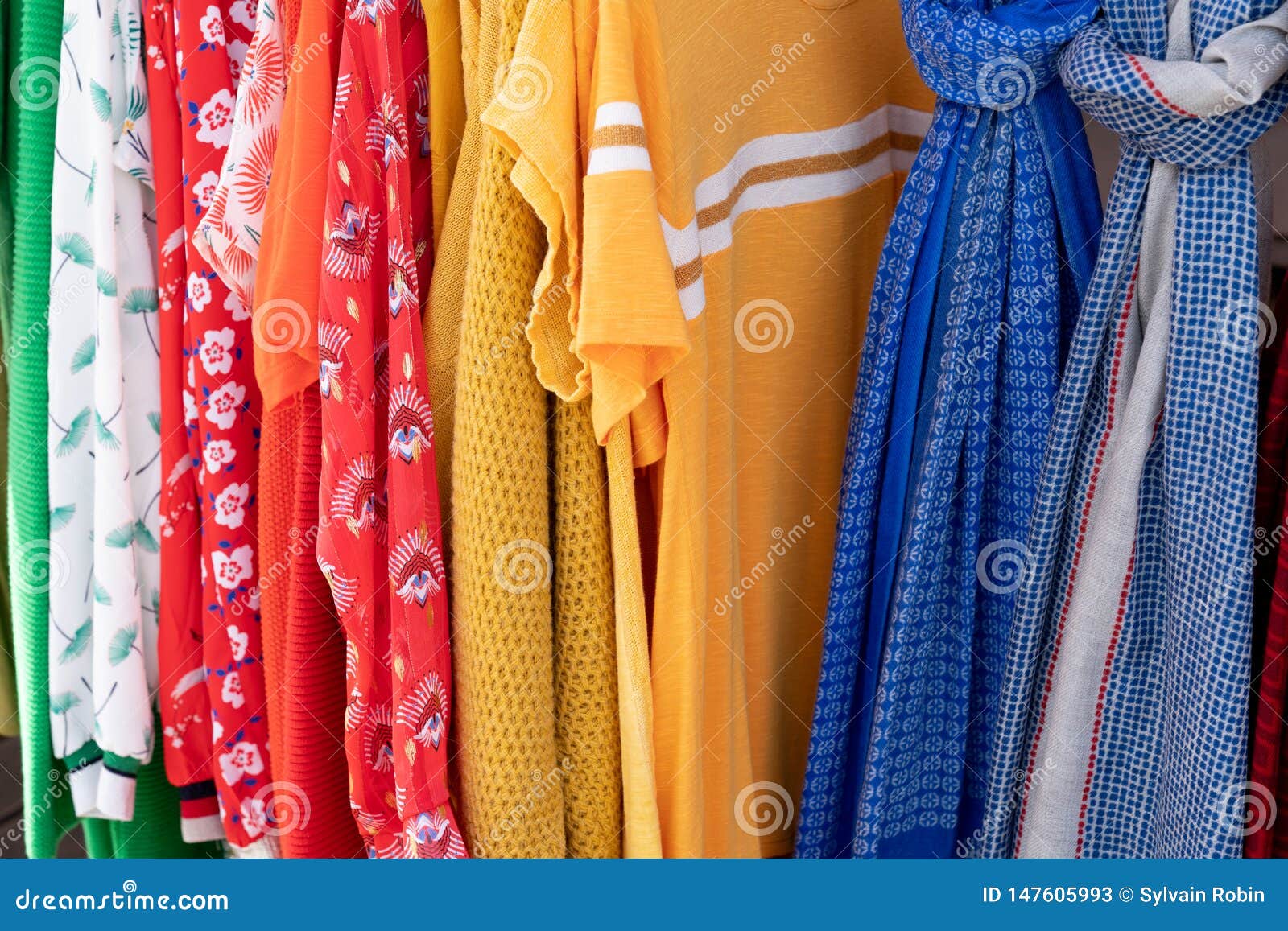 Rainbow Colored Clothes on Hangers in a Retail Shop in Fashion and ...