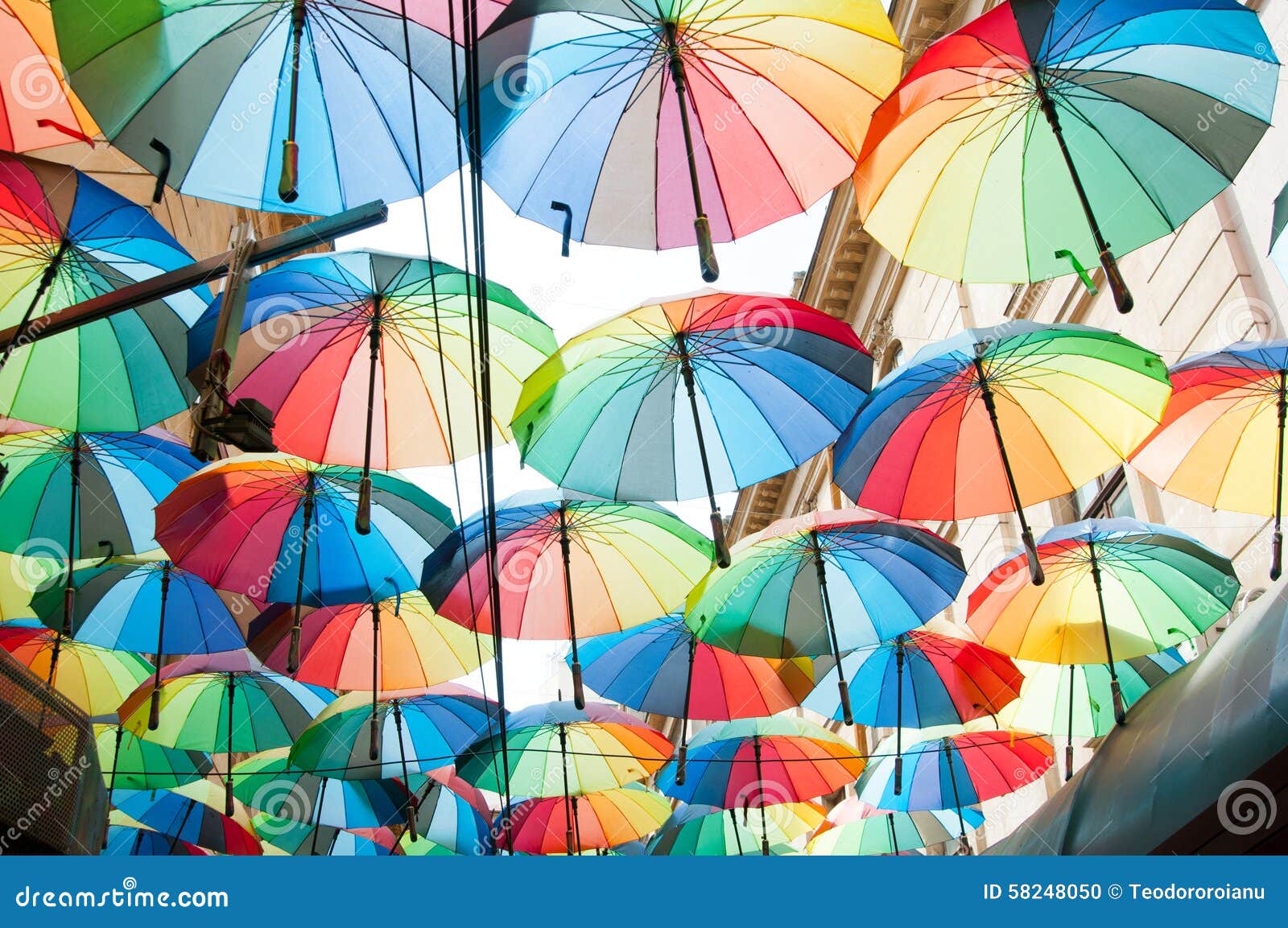 Rainbow colored umbrellas stock photo. Image of costumers - 58248050