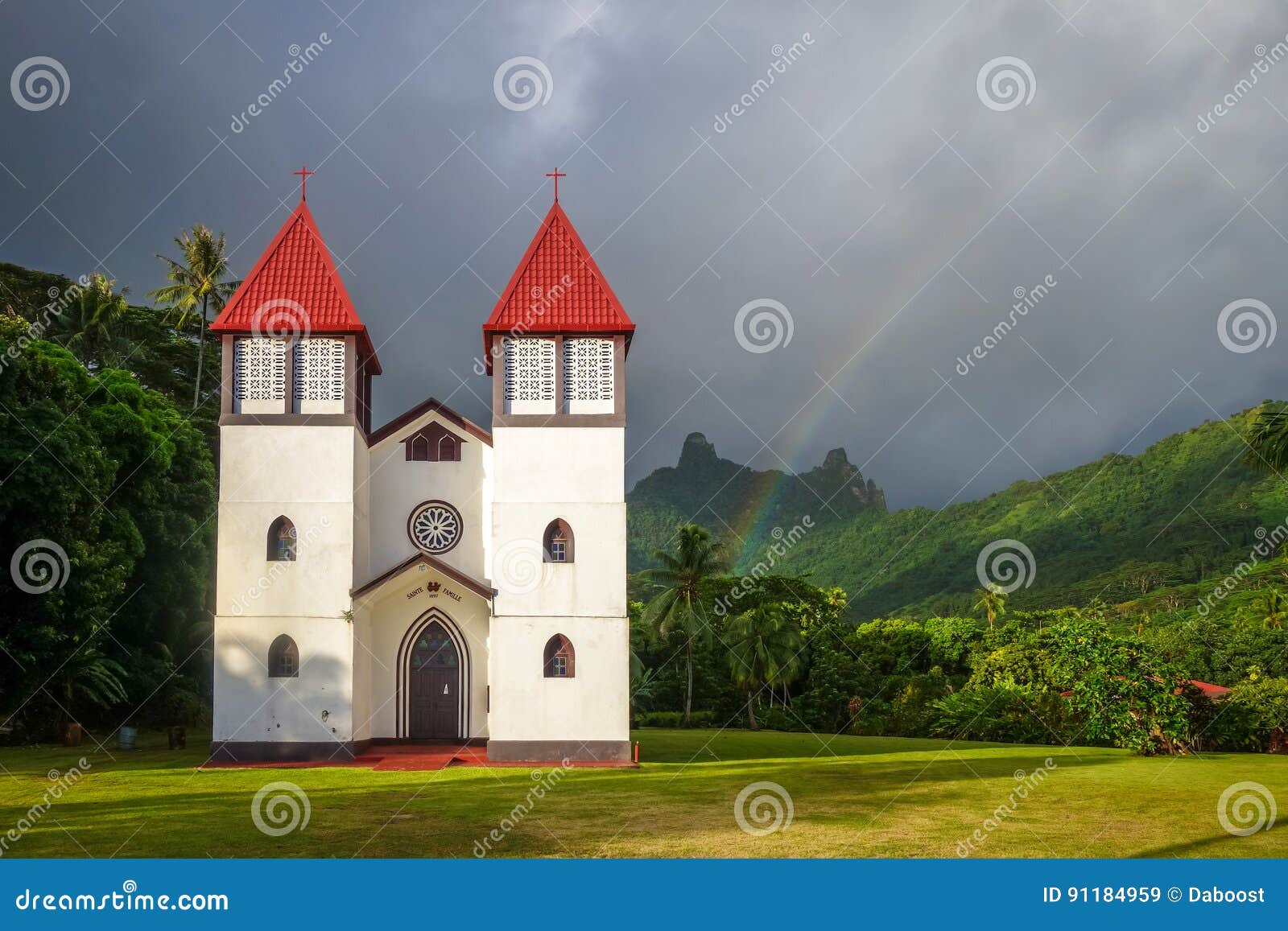 rainbow on haapiti church in moorea island, landscape