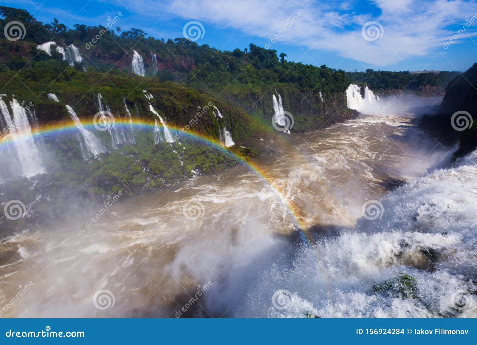 rainbow over cataratas del iguazu waterfall, brazil
