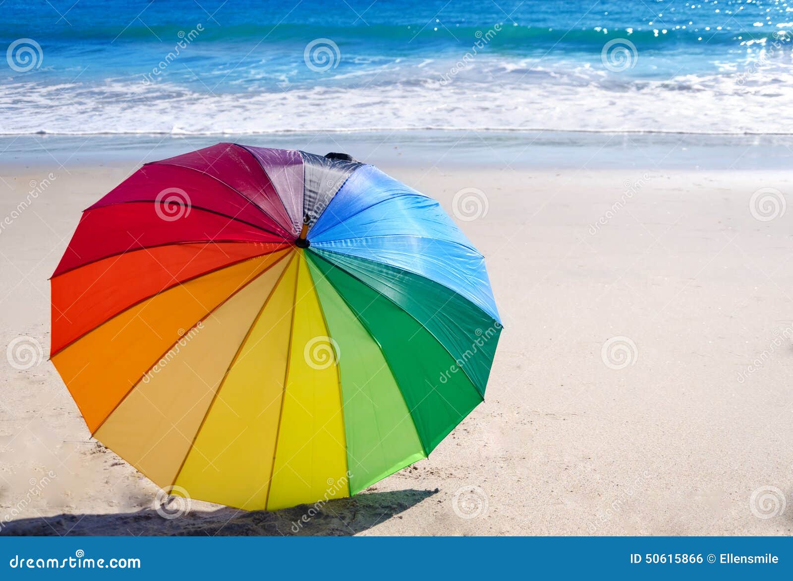 Rainbow Umbrella by the Ocean Stock Photo - Image of blue, tourism ...