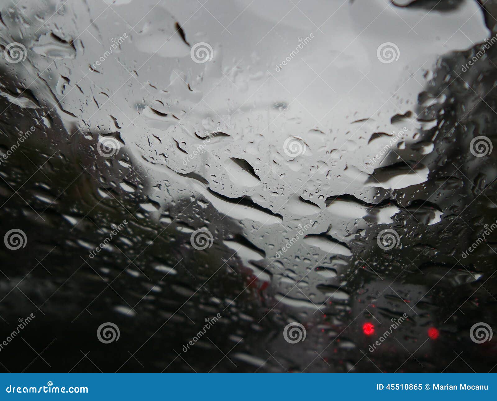 Raindrops Forming Streaks on a Windshield Stock Image Image of