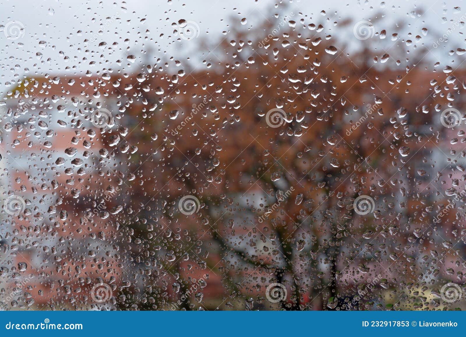 raindrops on the glass. window in march. season specific. portugal. almada. early spring.