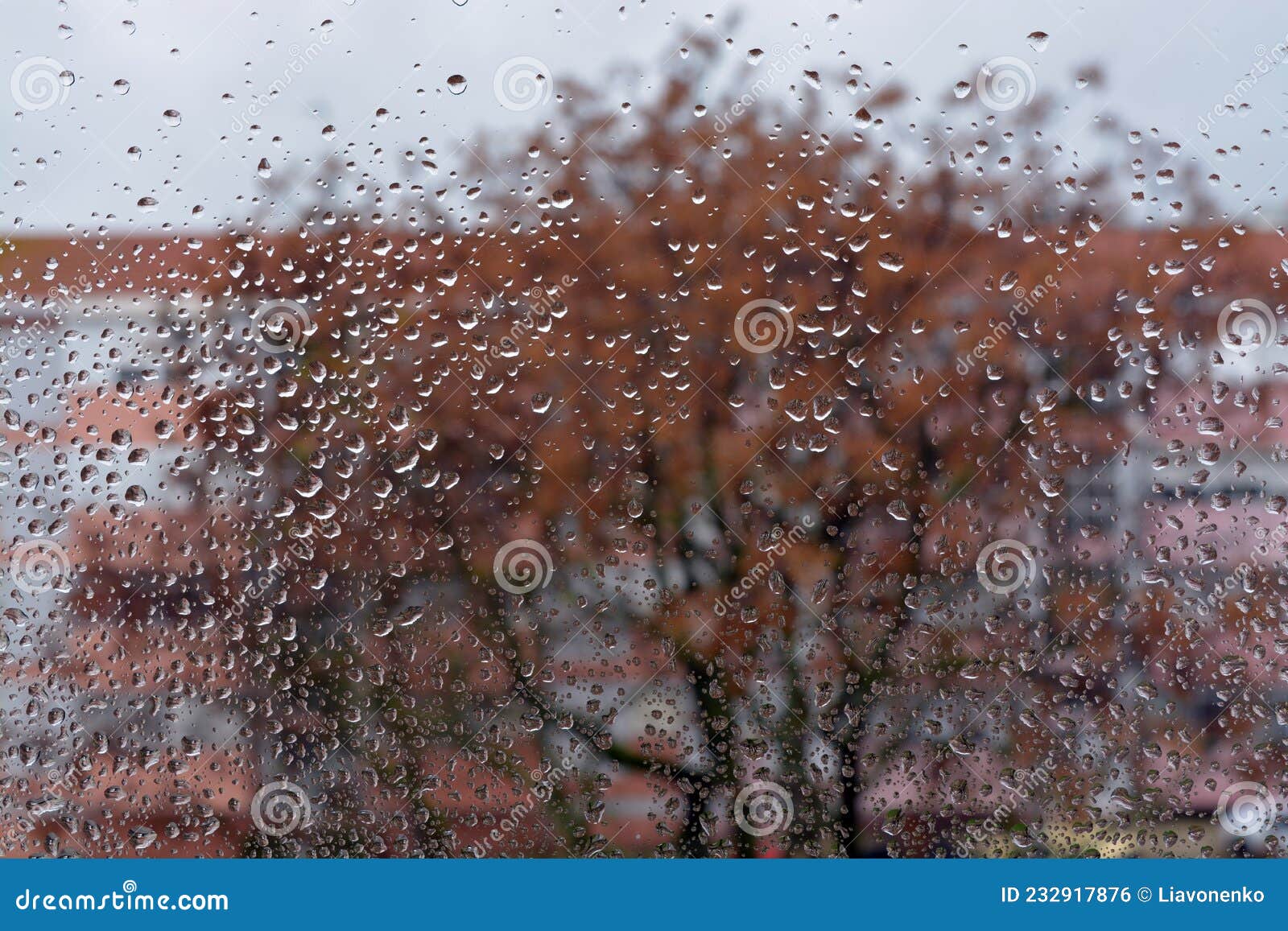raindrops on the glass. window in march. season specific. portugal. almada. early spring.