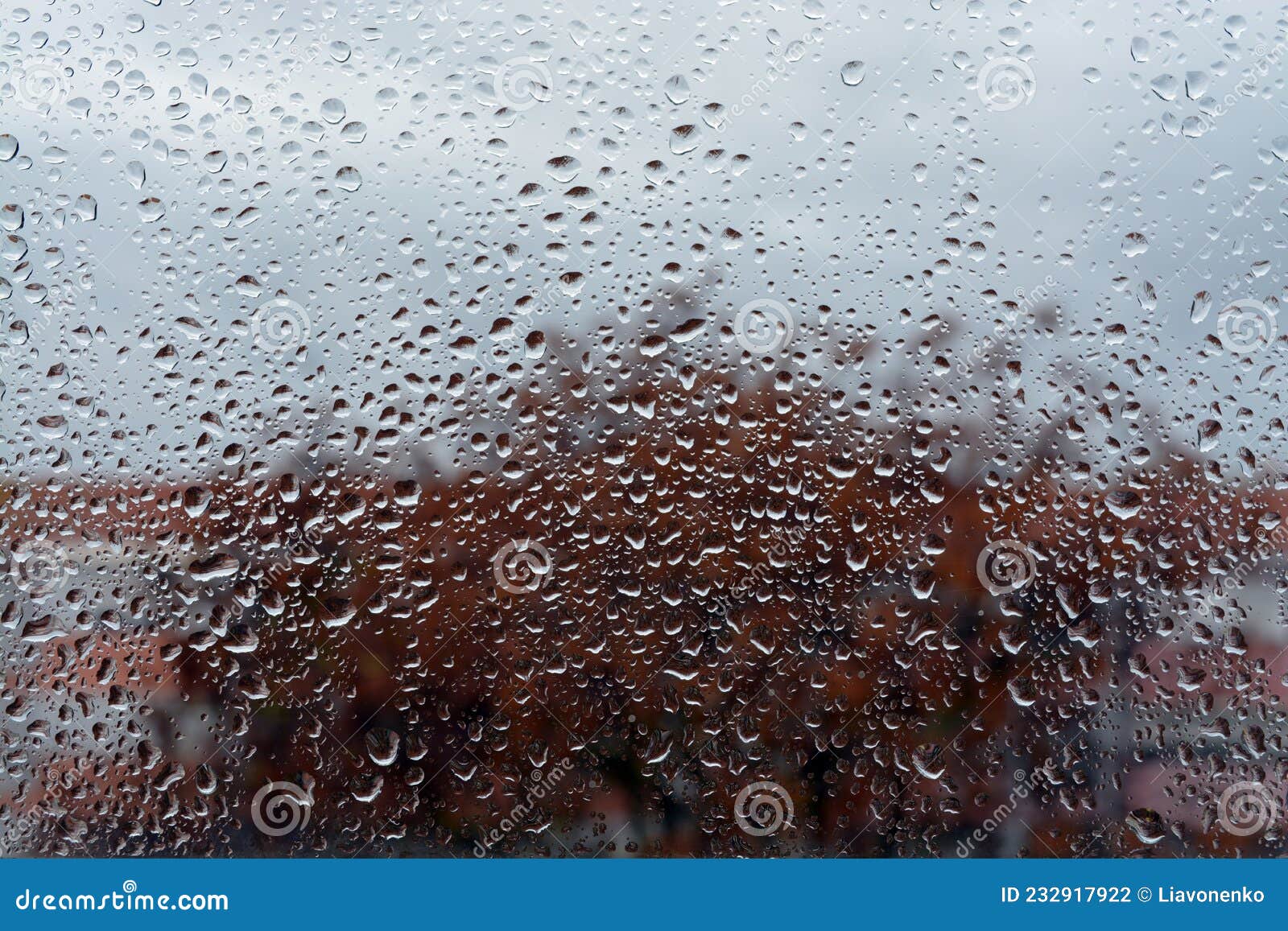 raindrops on the glass. window in march. season specific. portugal. almada. early spring.